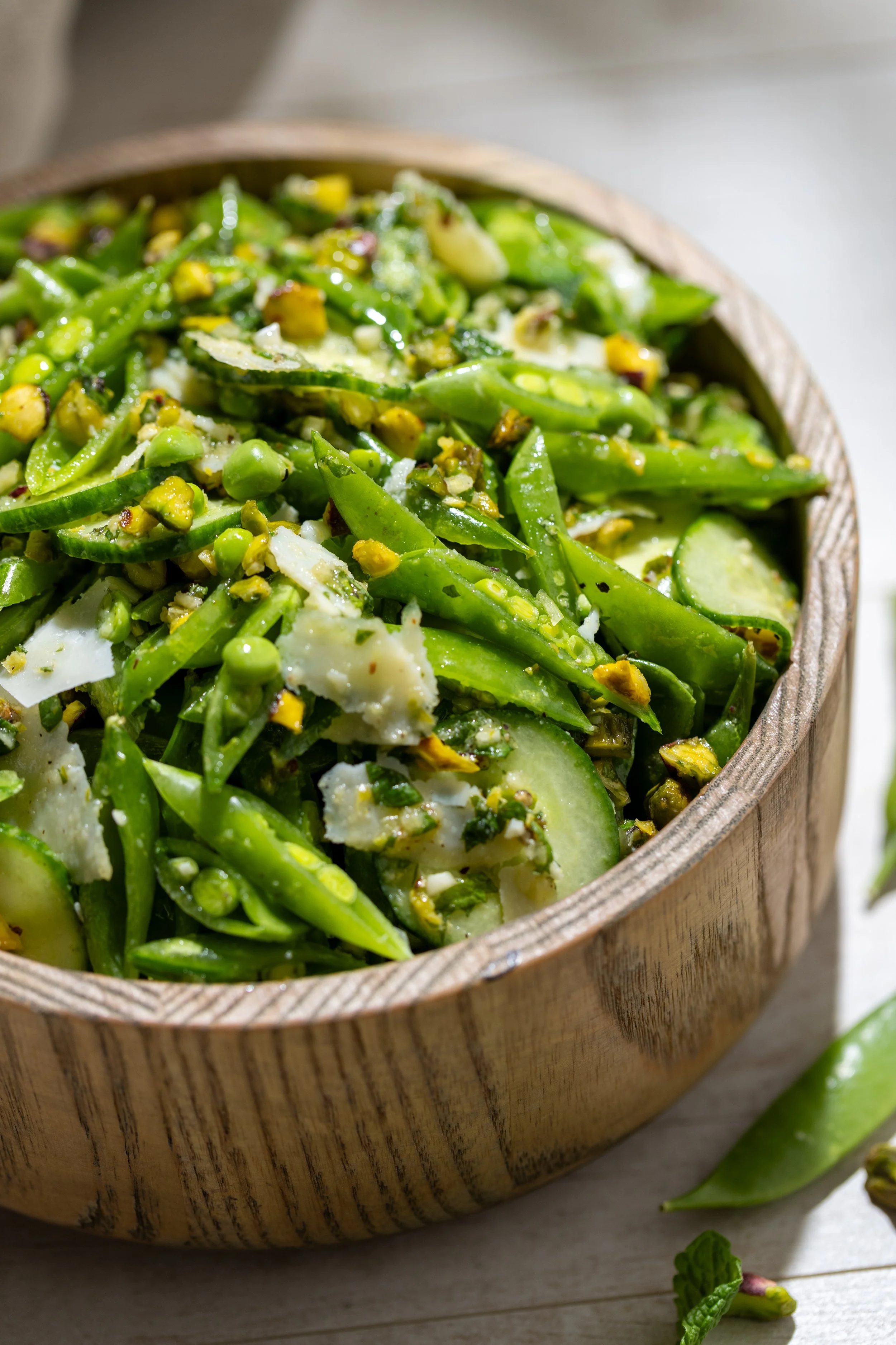 Lemon Dijon Sugar Snap Pea Salad in wooden bowl
