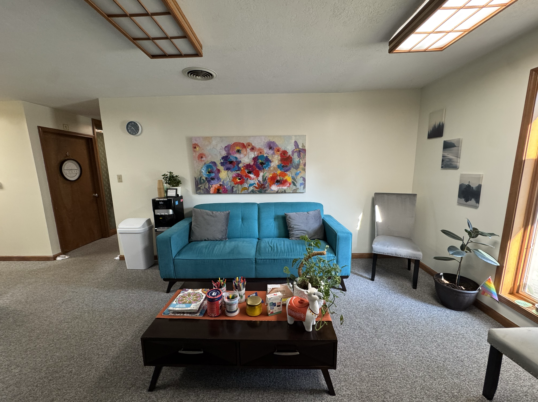 Bright, welcoming lobby with comfort in mind: natural light, plants, and space to exhale.