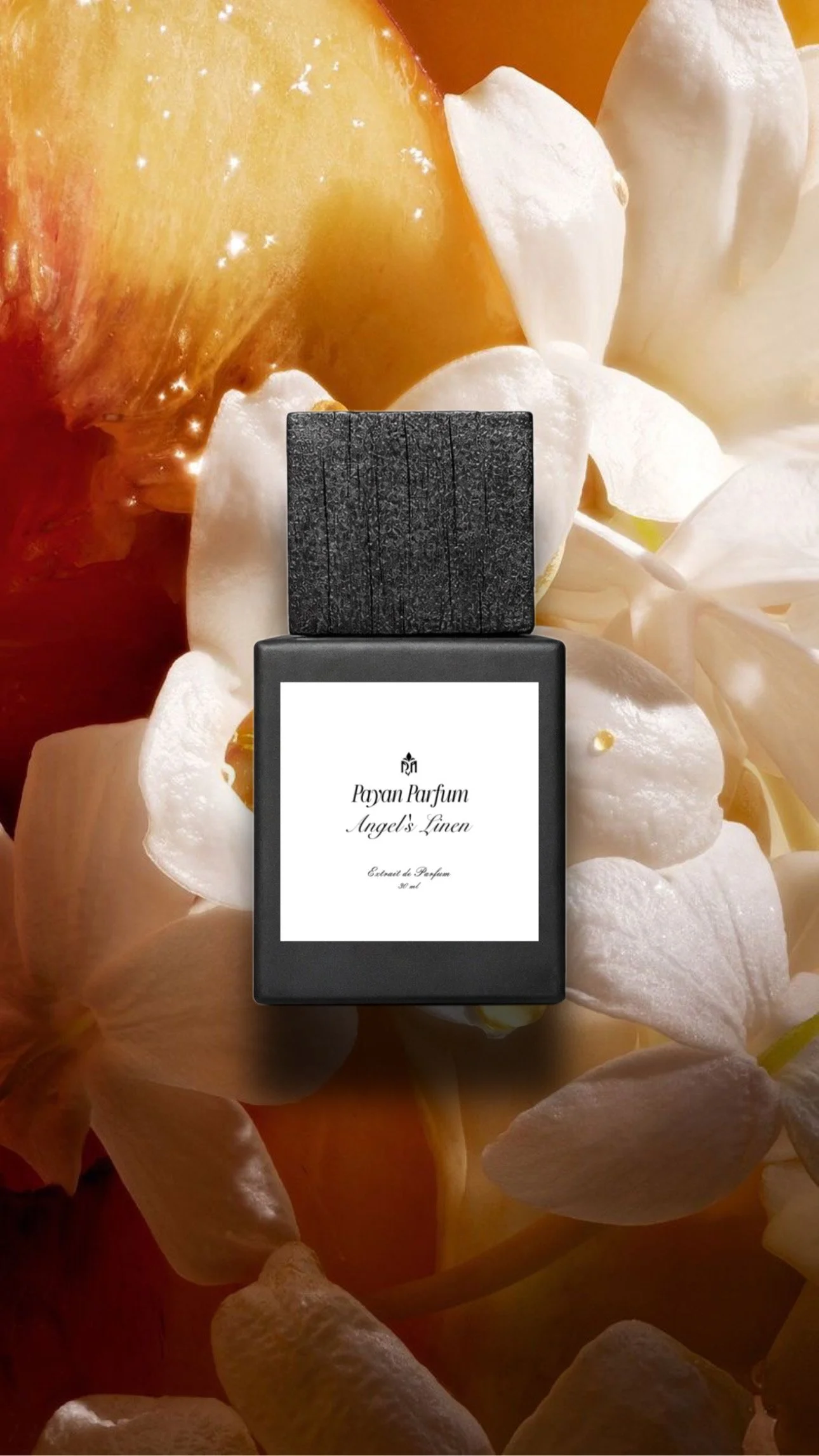 A black perfume bottle labeled 'Payan Parfum Angel's Linen' surrounded by white flowers, musk, and decorative golden elements.