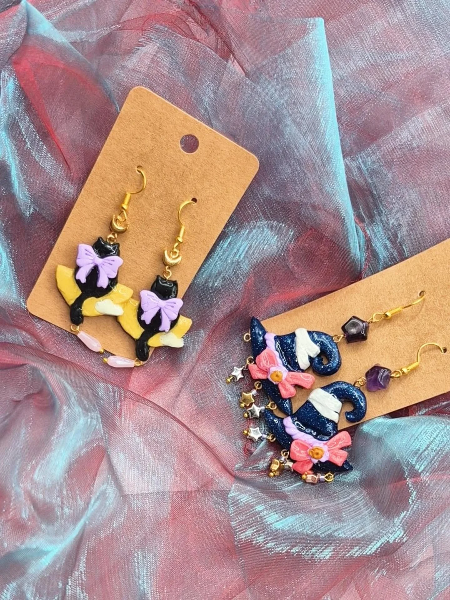 It's spooky season! 🎃👻 
New Halloween-esque magical themed polymer clay earrings are in stock! Come grab some this Friday at @englewood_row third Friday Artwalk! $25 per pair :) hardened and coated for extra sturdiness.

#wearperiphery