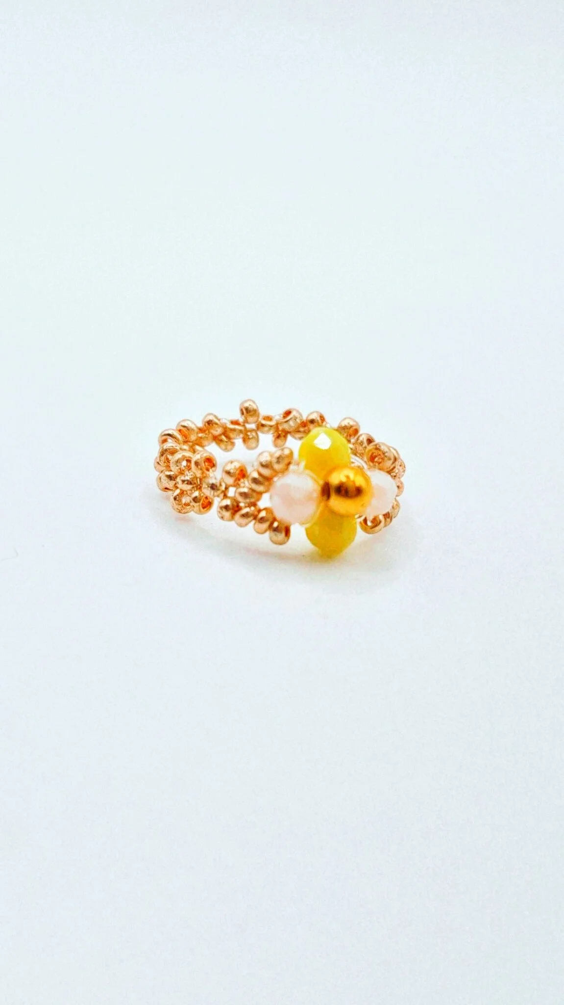 a beaded flower ring with colorful glass fasceted crystal beads