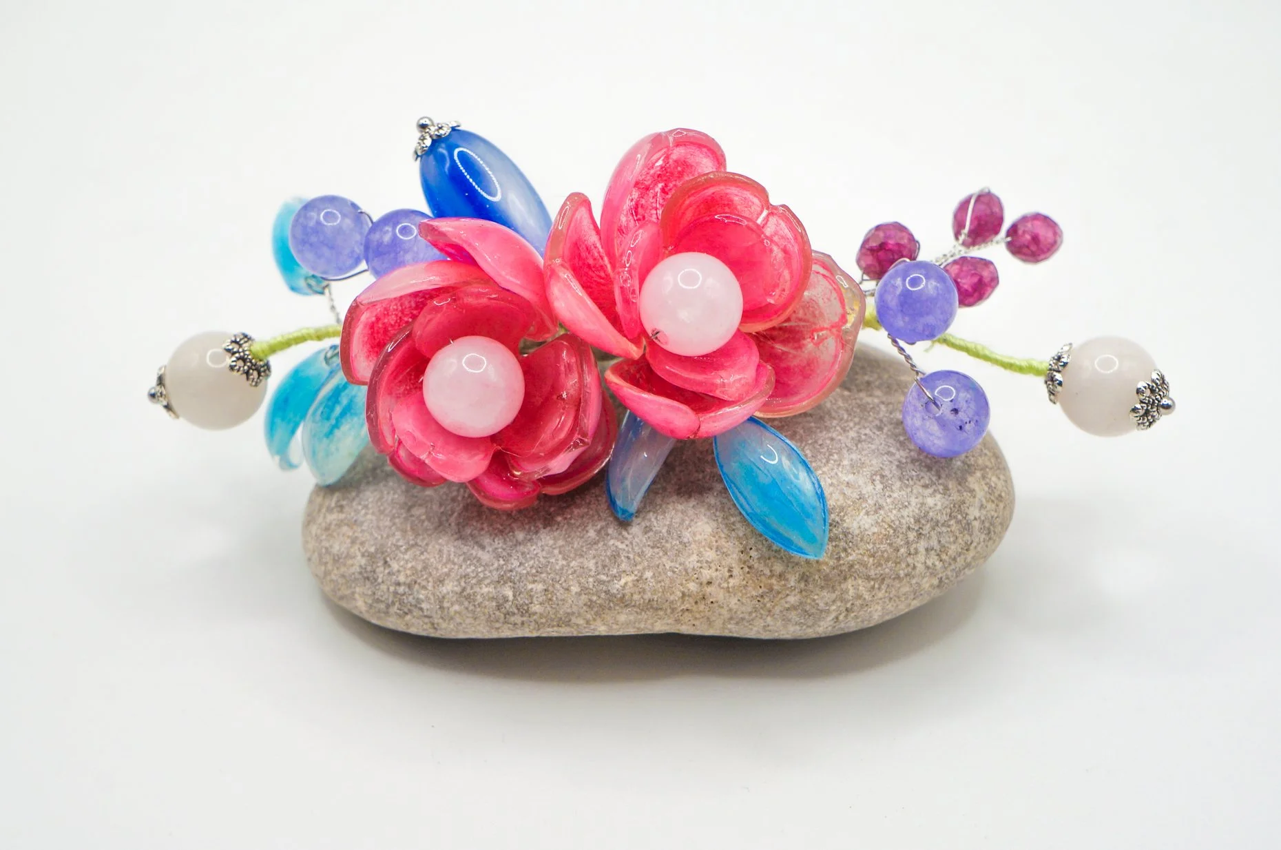 a large handmade silver hair barette/comb featuring pink peony and sky blue leaves with various gemstones