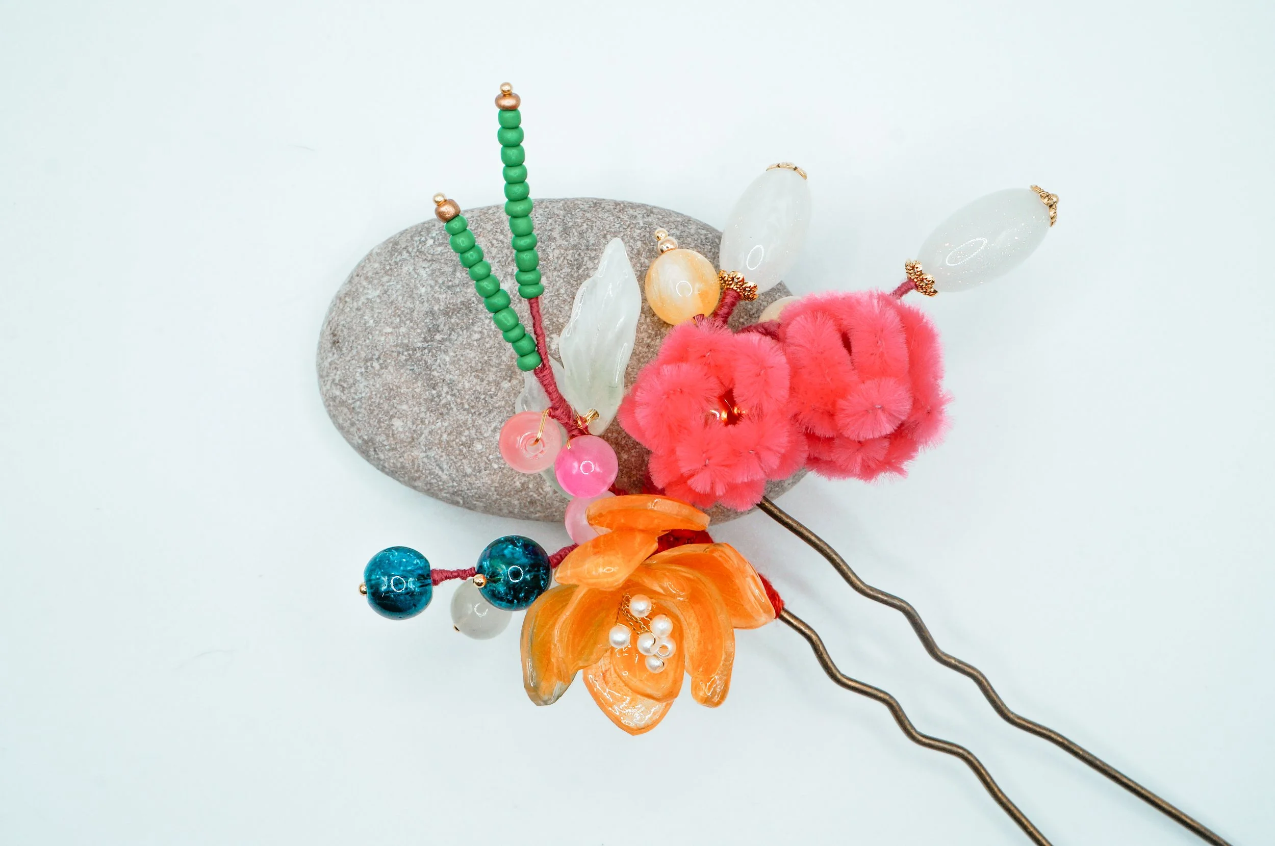 Another angle of a bronze, straight Chinese hair stick with royal bouquet