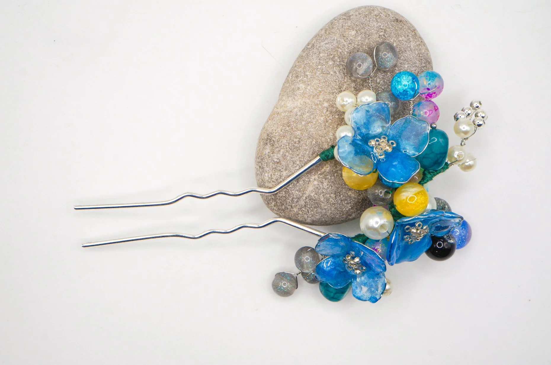 a birdview look of a blue mica powder dipped handmade chinese hairstick with various gemstone and glass beads