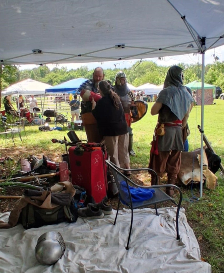Guys armoring up for the fighting demo at the Mad County renaissance faire, Gurley, AL.