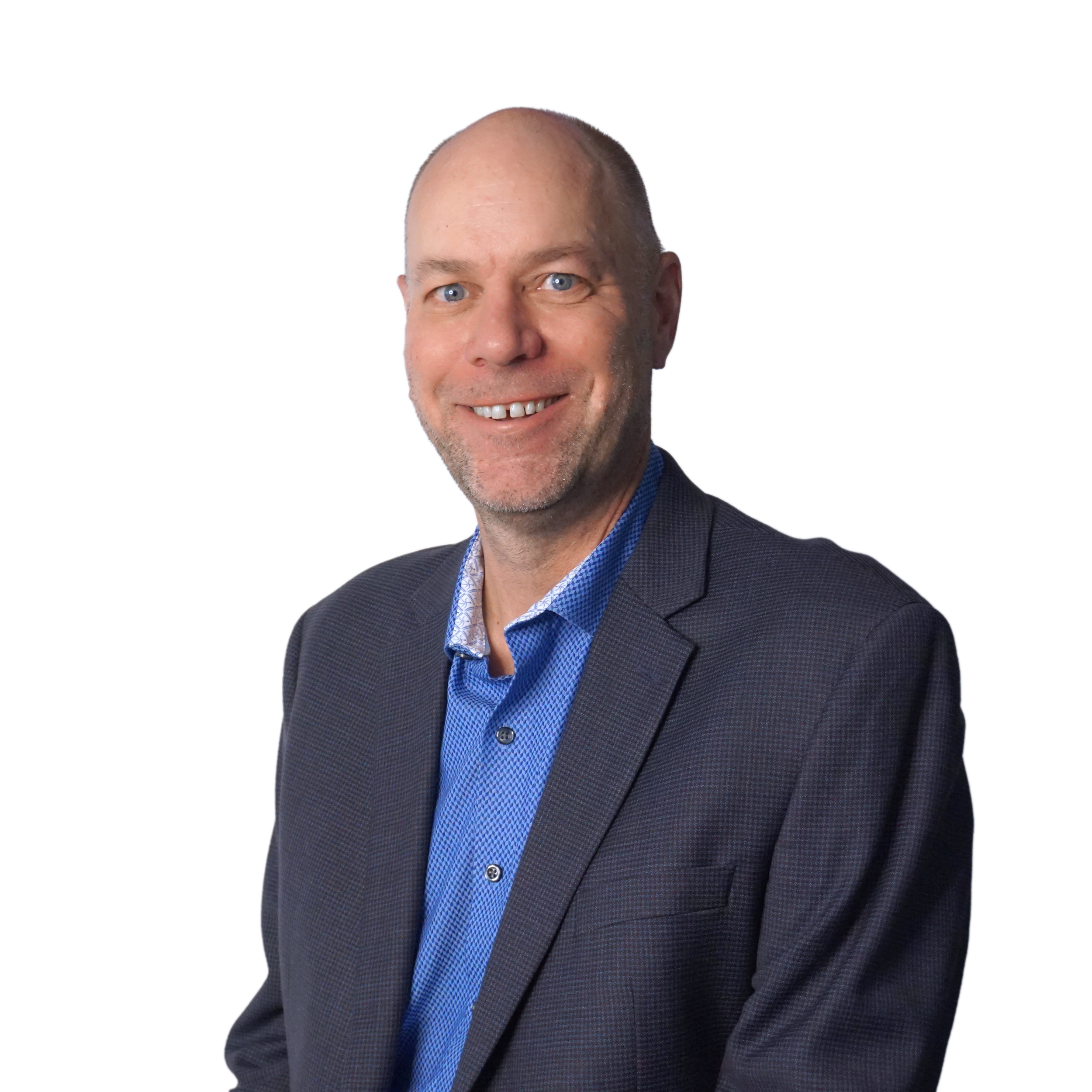 A man with a bald head and blue eyes wearing a checkered blazer and a white shirt, posing against a white background.