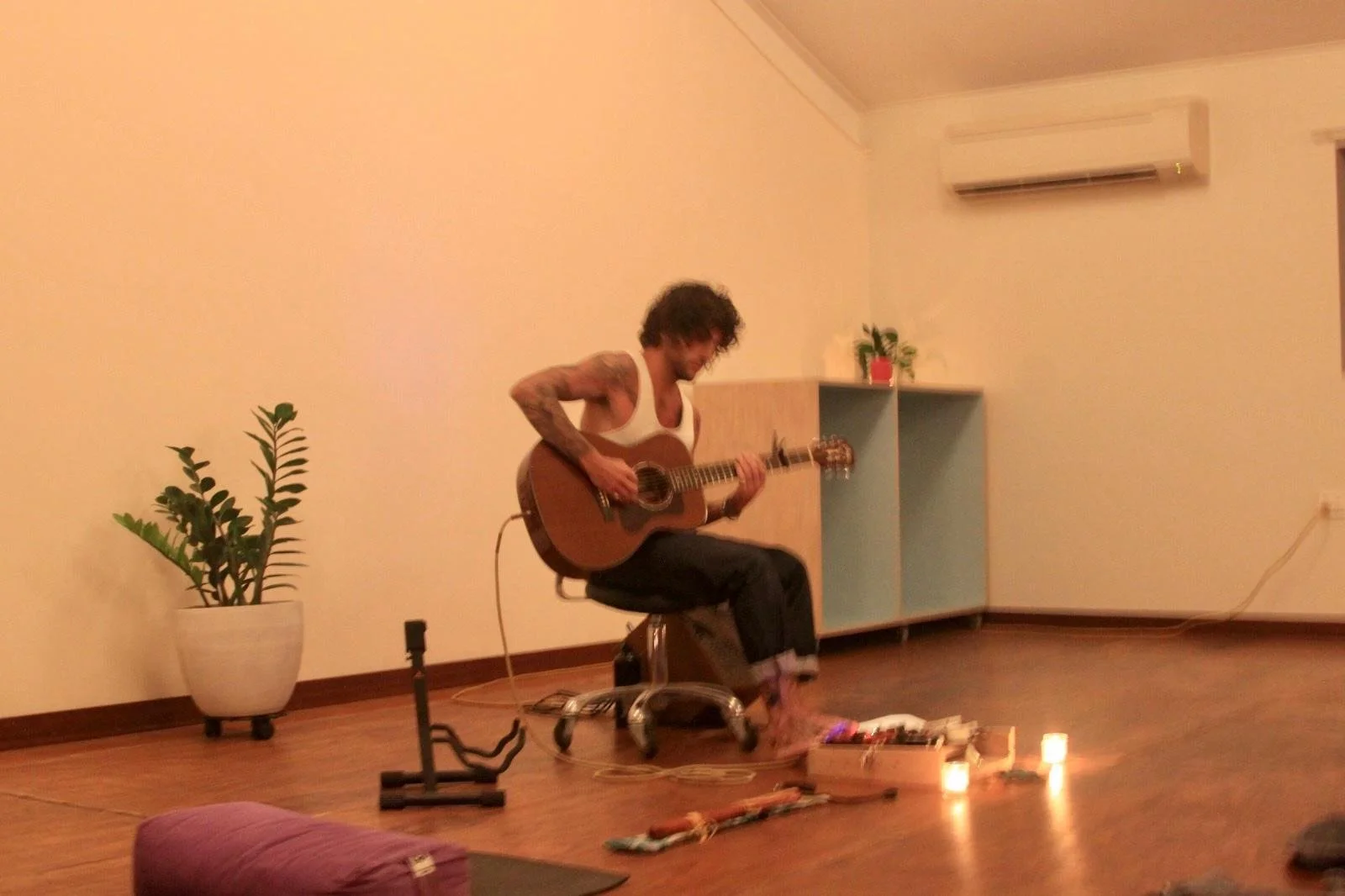 Taylor practicing music therapy, Balance, Therapy, Integrated Guidance, Coaching, Yoga, Workshop Facilitation and Art Therapy.