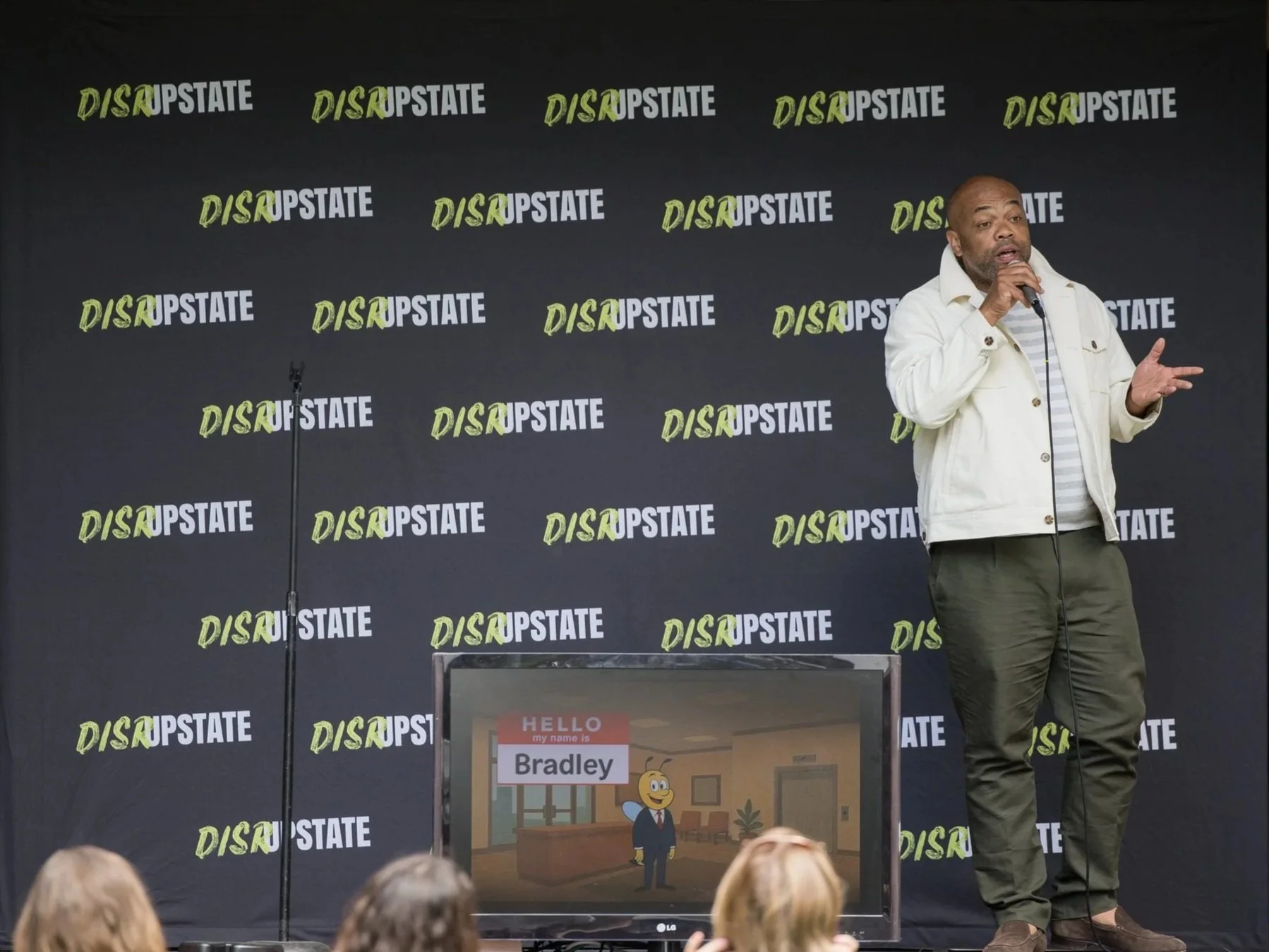 Brian Tucker presents on stage at DisrUpstate Leadership Summit 2026