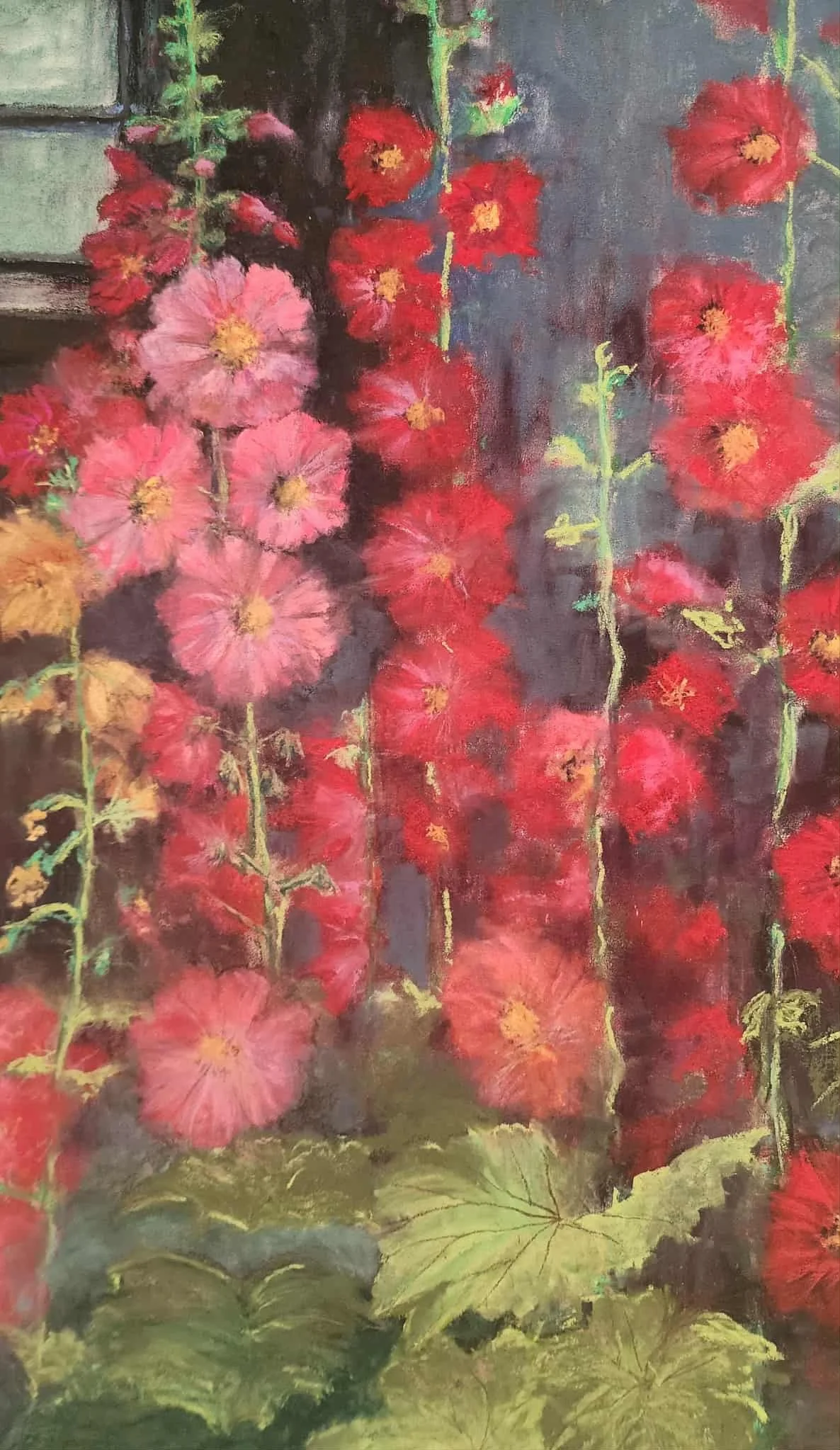 A colorful painting of tall flowers with large pink, red, and orange blossoms against a dark background with green leaves at the bottom.