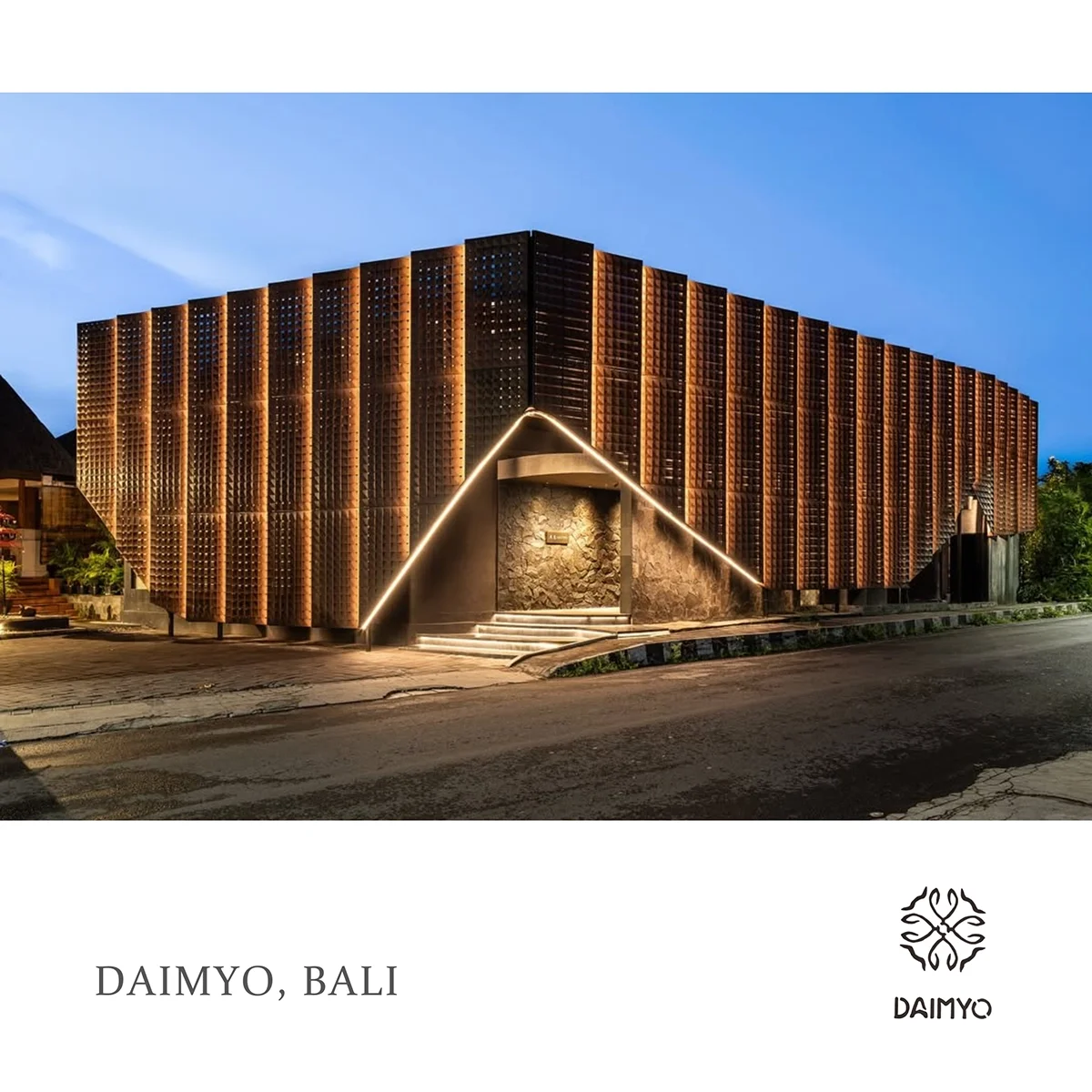 Modern building with wooden facade and light accents, located in Bali, Indonesia.