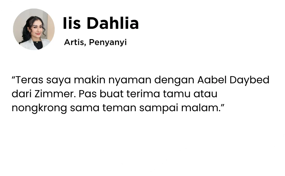 Profile picture of Lis Dahlia, a young woman with dark hair, wearing a white blazer and a black top, smiling.