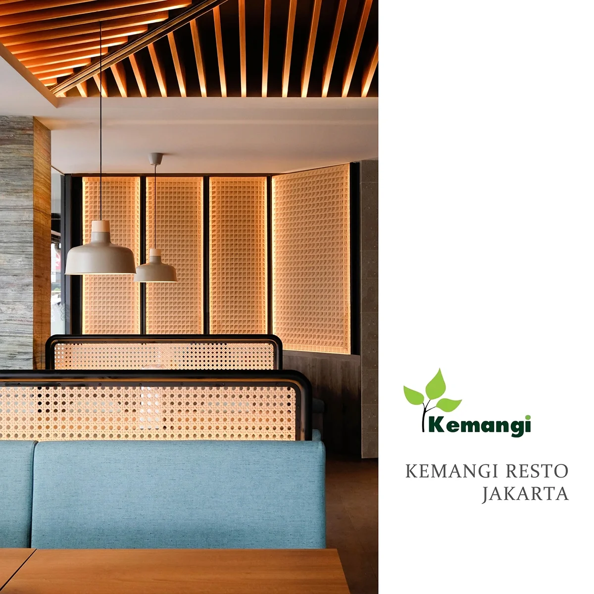 Interior of Kemangi Resto Jakarta with modern decor, wooden accents, pendant lights, and seating area.