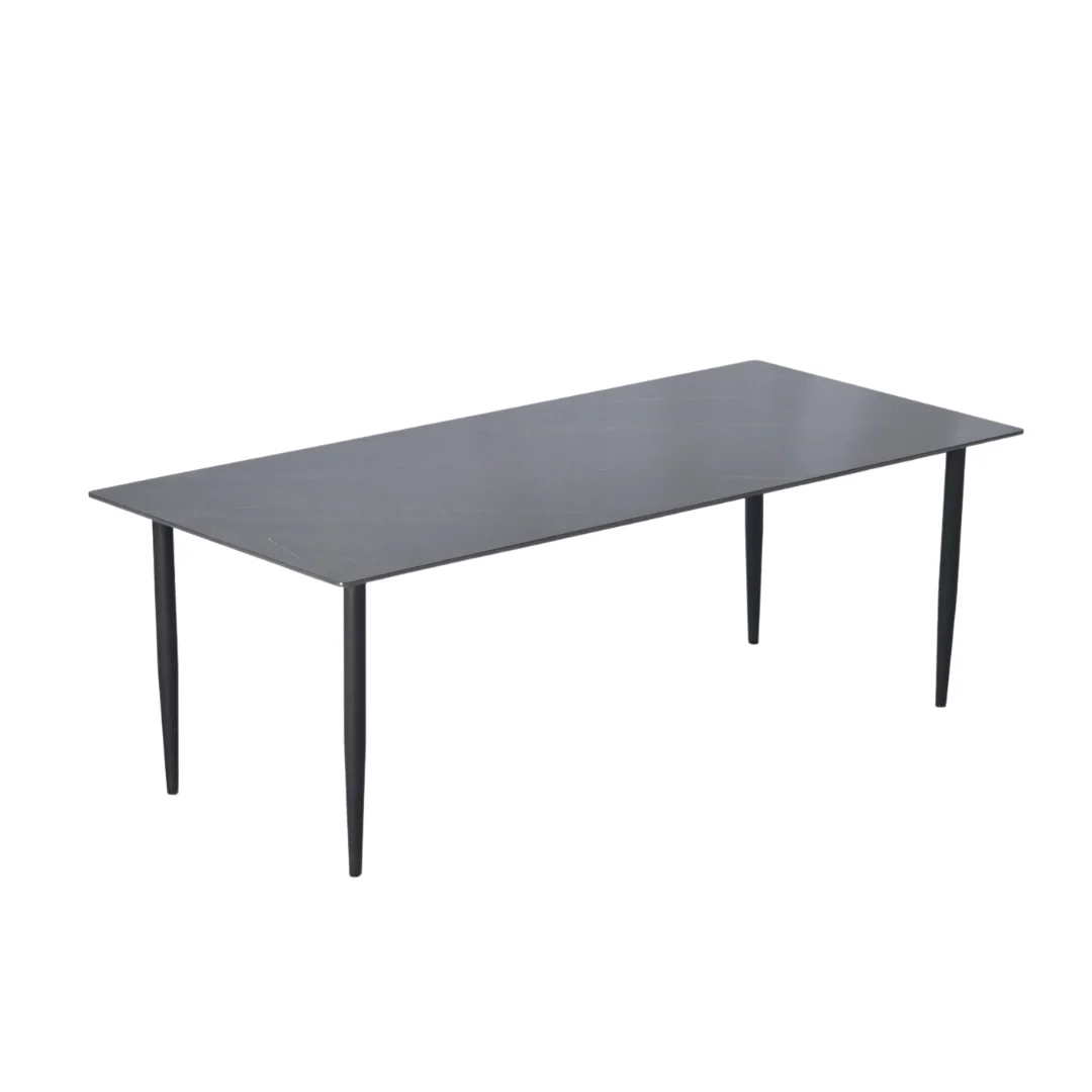 A modern, rectangular black table with four tapered legs against a white background.