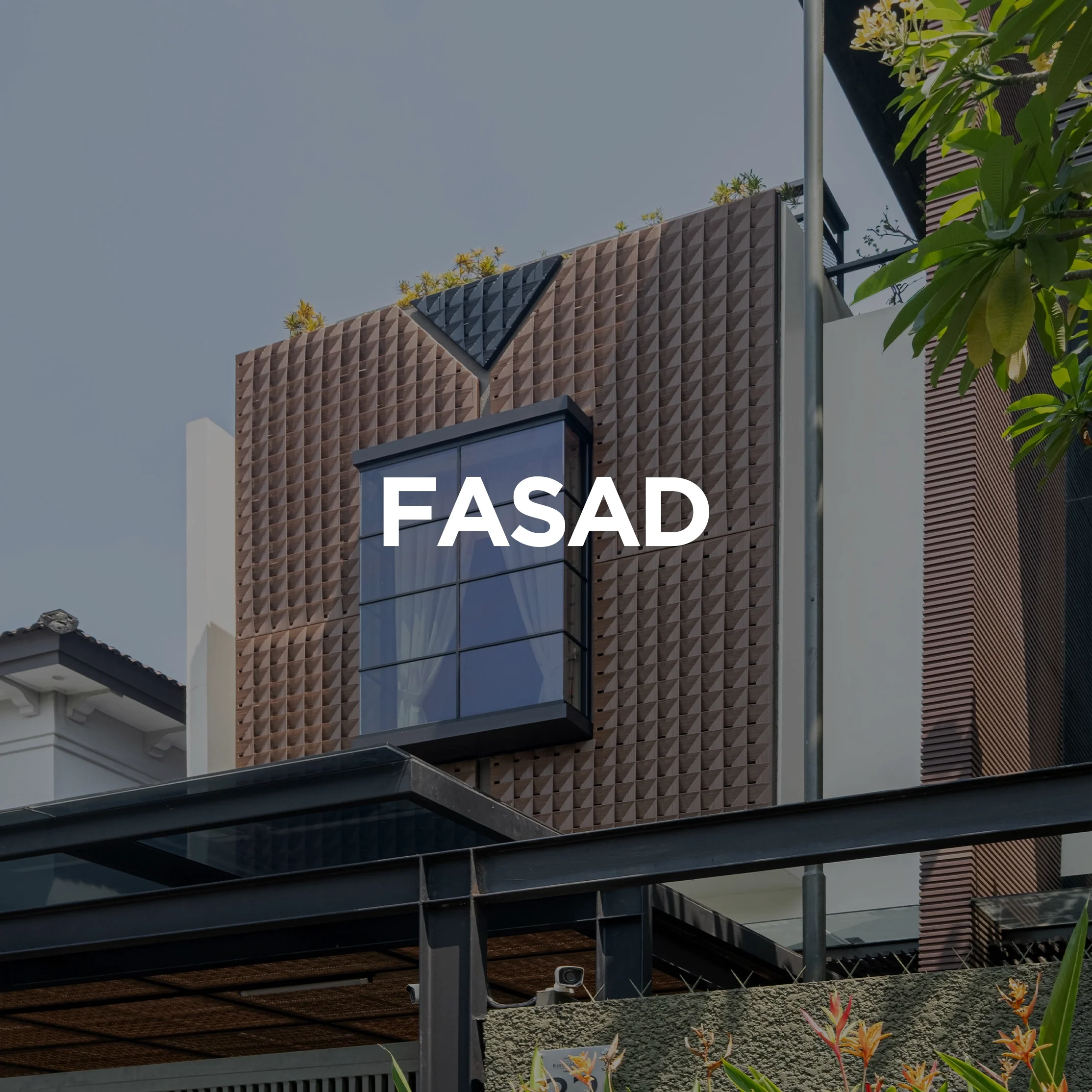 Modern building facade with textured brown panels and large glass window, with 