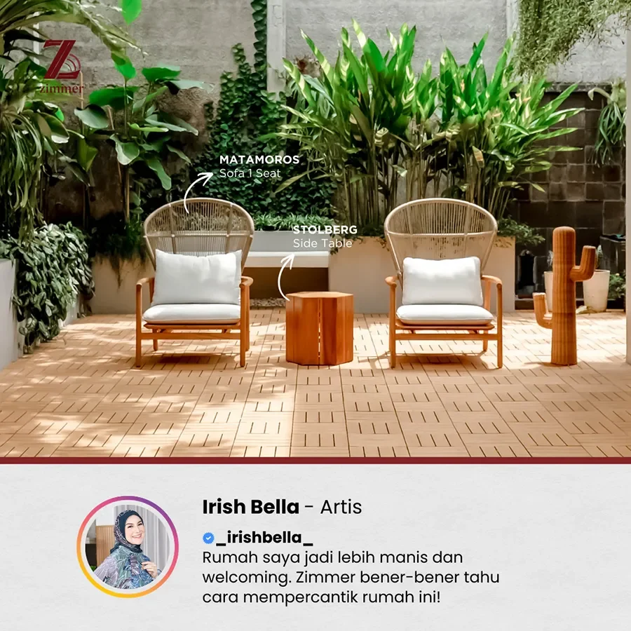 Modern outdoor seating area with a large L-shaped white cushioned sofa and a wooden coffee table on a dark tiled patio, surrounded by glass walls and greenery.