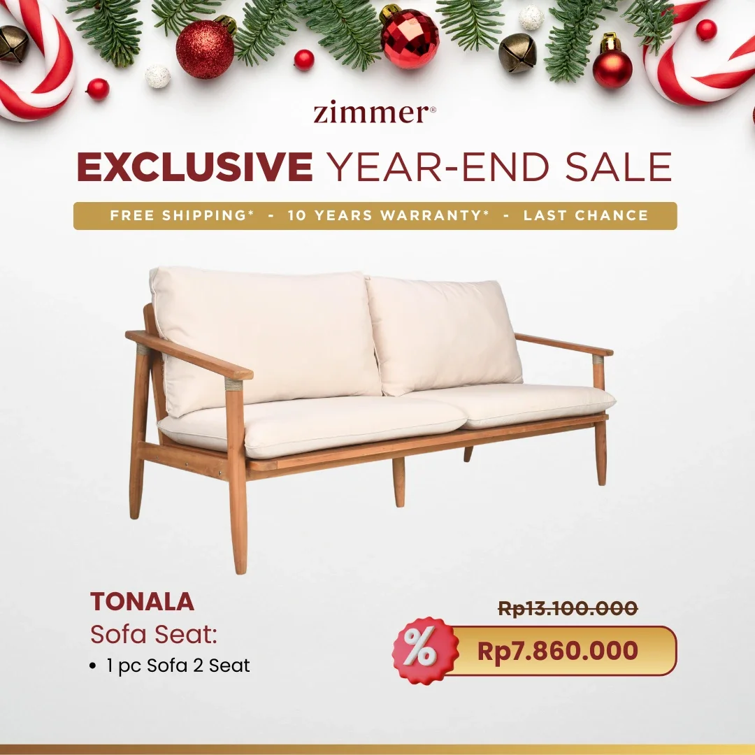 A promotional advertisement for Zimmer's year-end sale featuring a wooden sofa with cream cushions, holiday decorations including red and gold ornaments, and discounted price of Rp7.860.000.
