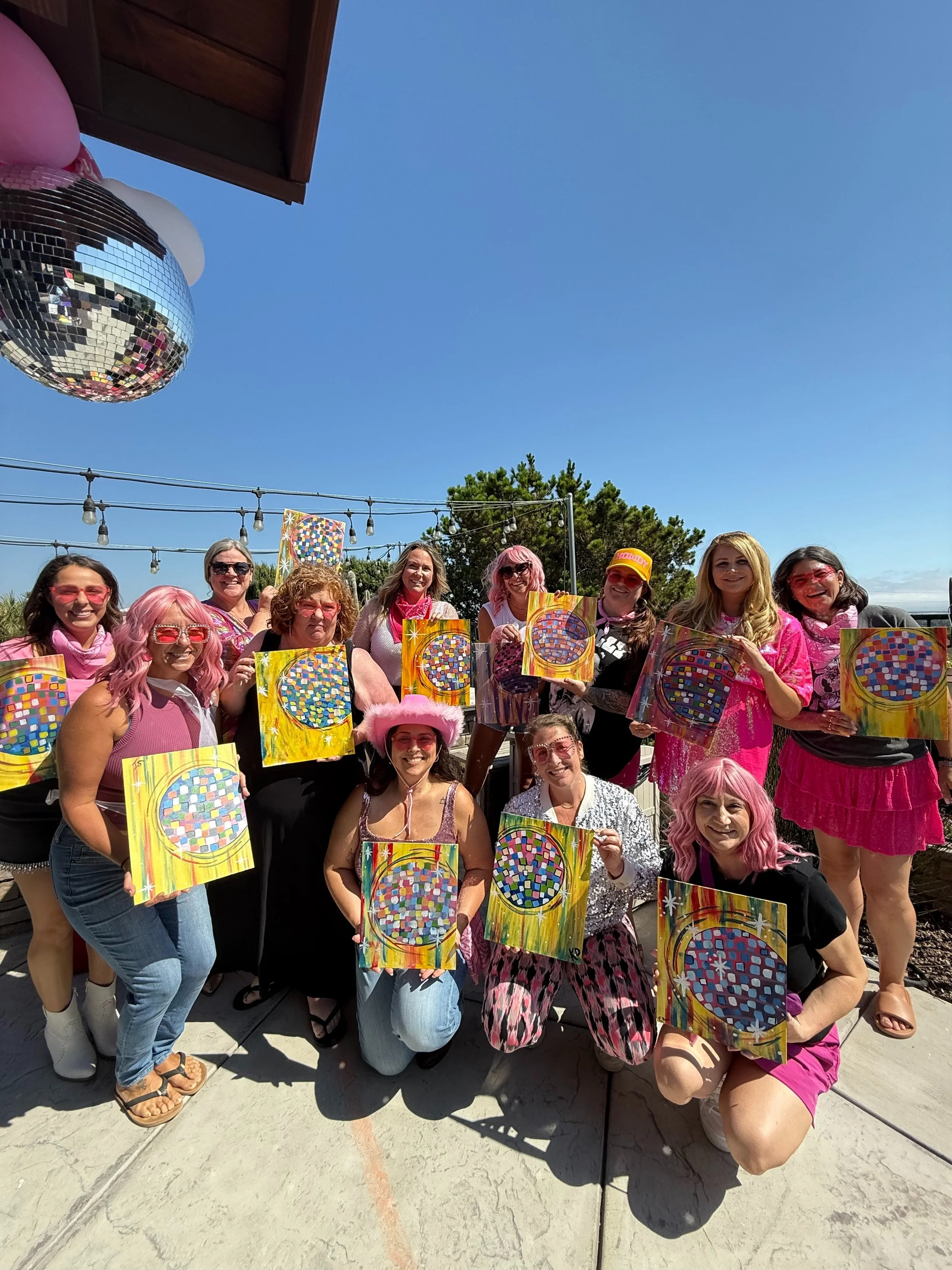 Group of women at a colorful outdoor paint party in Westlake Village, hosted by Poppin’ Palette mobile paint parties serving Conejo Valley, Calabasas, and surrounding areas.