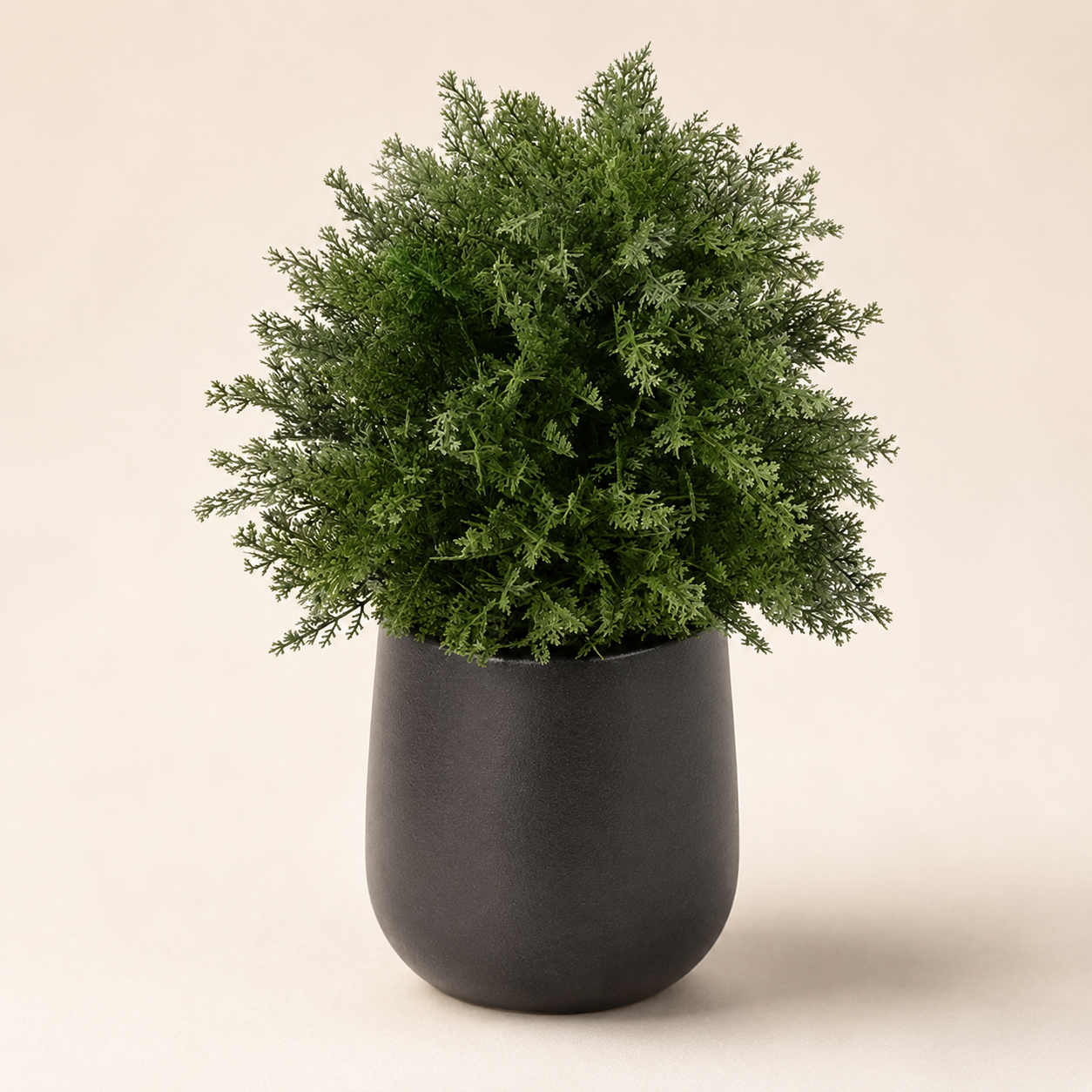 Artificial potted fern with dense realistic green foliage for home and commercial interiors