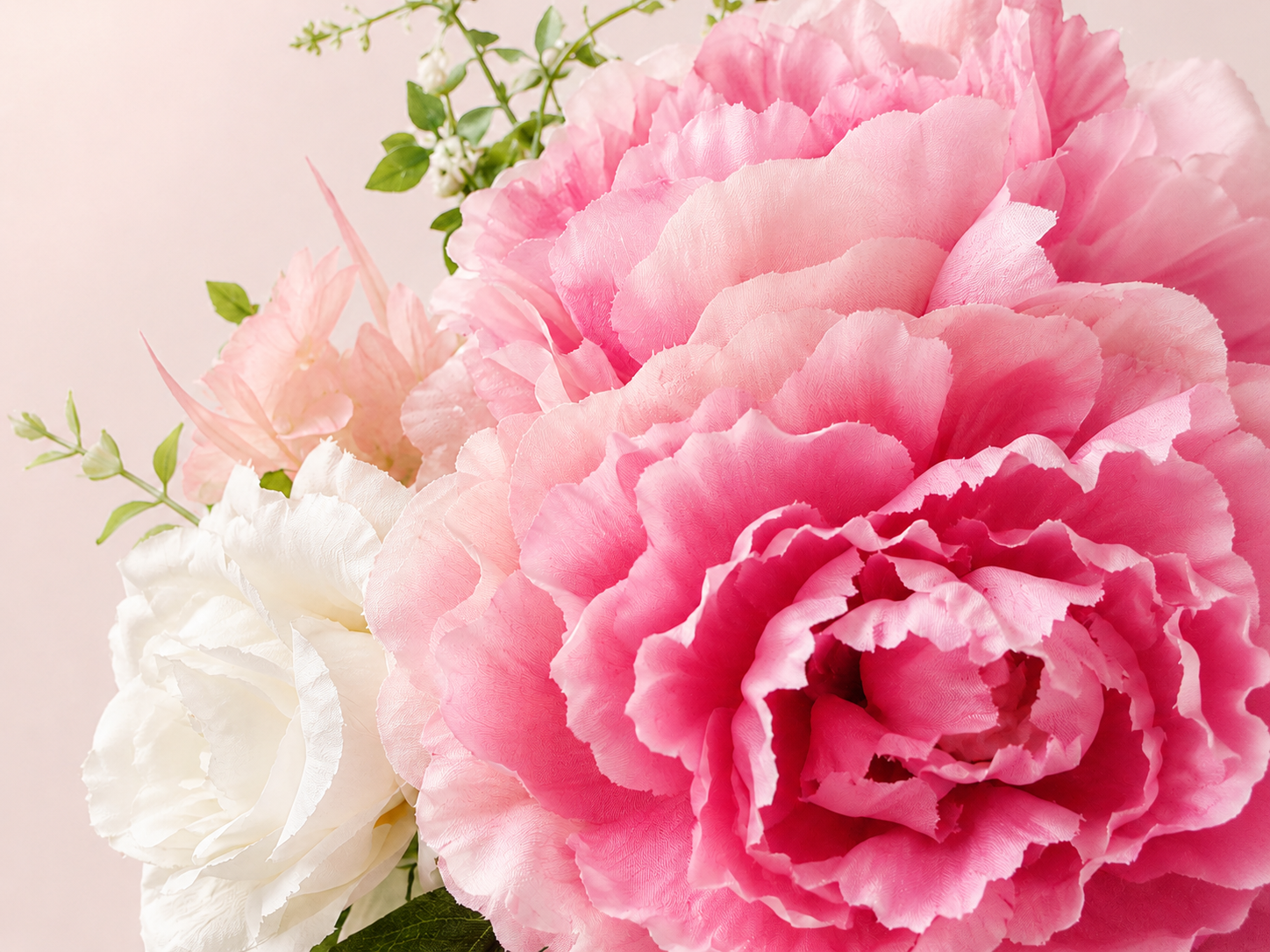 Artificial pink peony flower with white rose accents, close-up detail
