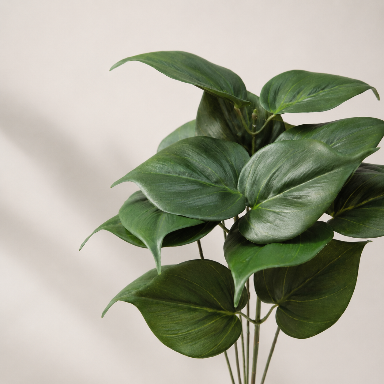 Artificial philo bush with broad realistic green leaves for indoor decorative arrangements