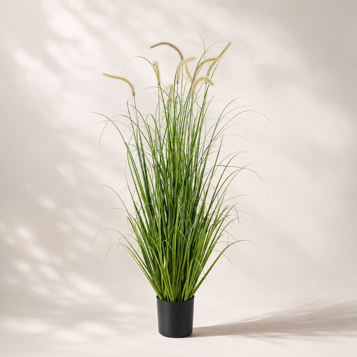 Artificial ornamental grass in a black pot for modern indoor and commercial décor