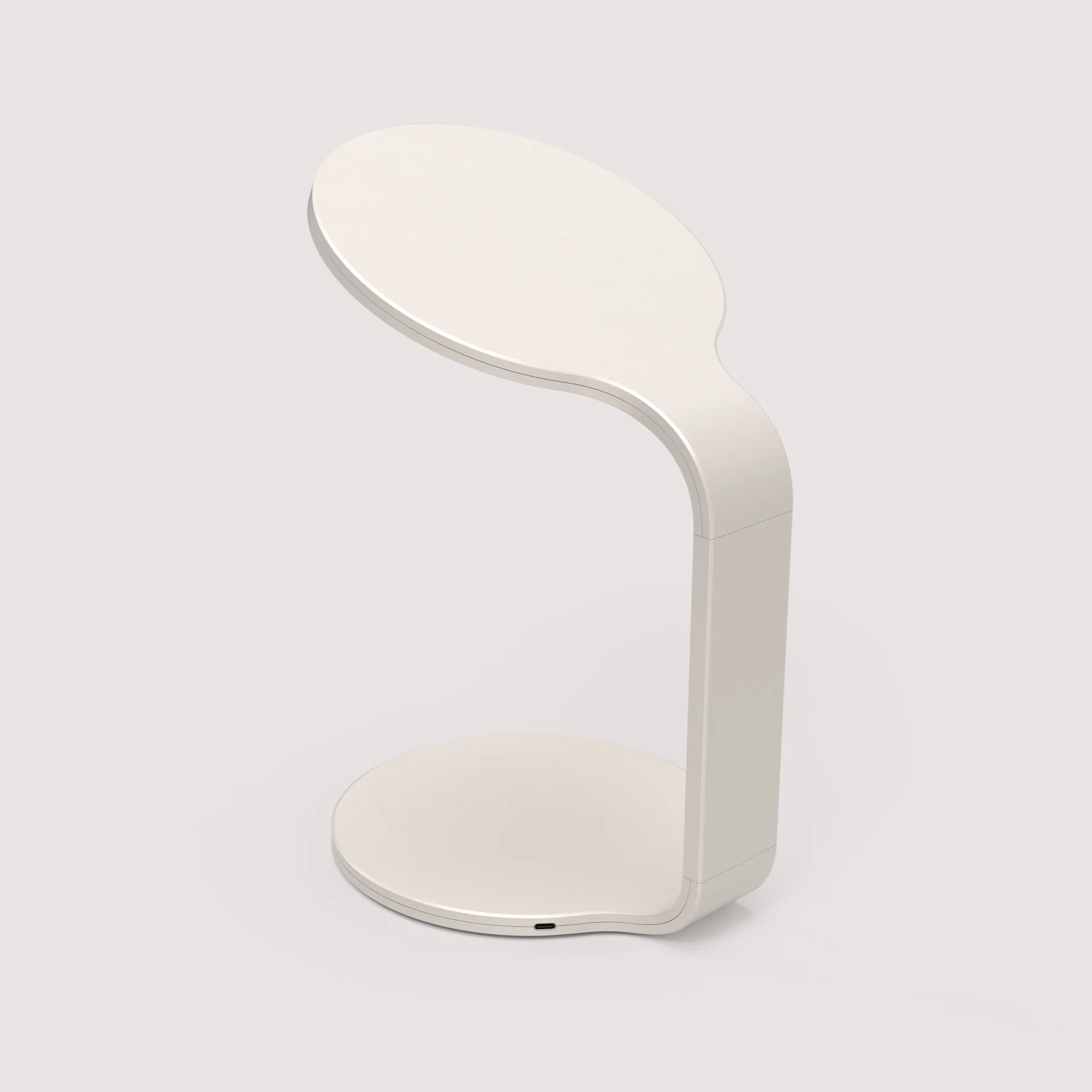 A white, U-shaped bedside table with two oval surfaces, one at the top and one at the bottom, connected by a curved vertical stand.