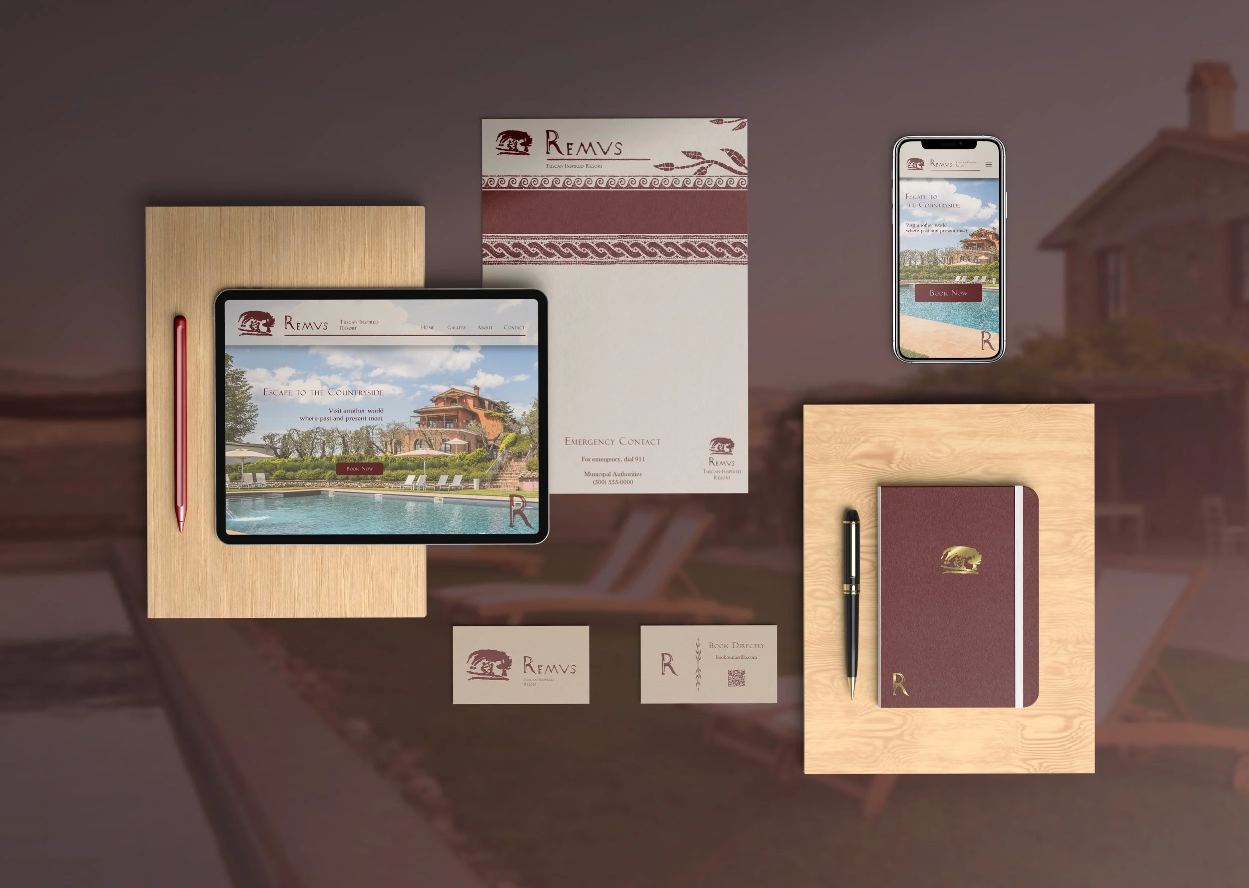 A display of promotional materials and devices for Remvs Tuscan-inspired resort, including brochures, business cards, a tablet, and a smartphone showing the resort’s website, all arranged on a wooden surface.