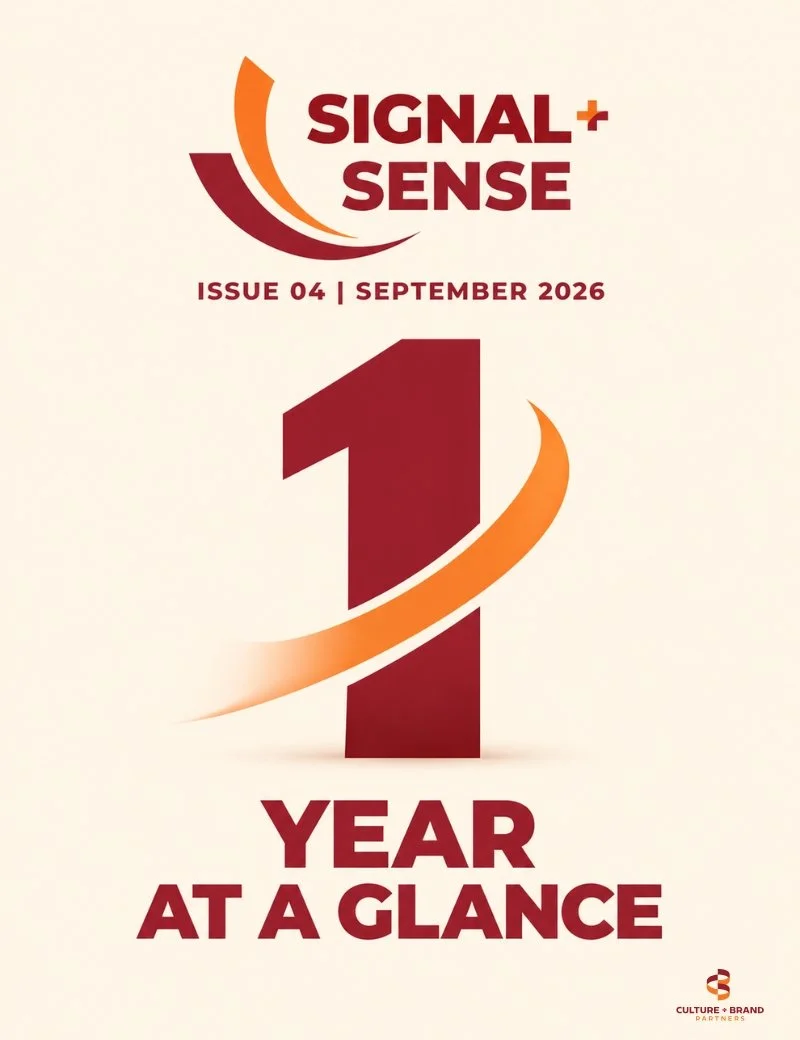 Signal + Sense Issue 04, September 2026. “Year at a Glance” anniversary cover featuring a large maroon number one wrapped by an orange swoosh, marking one year of the Culture + Brand Partners publication.