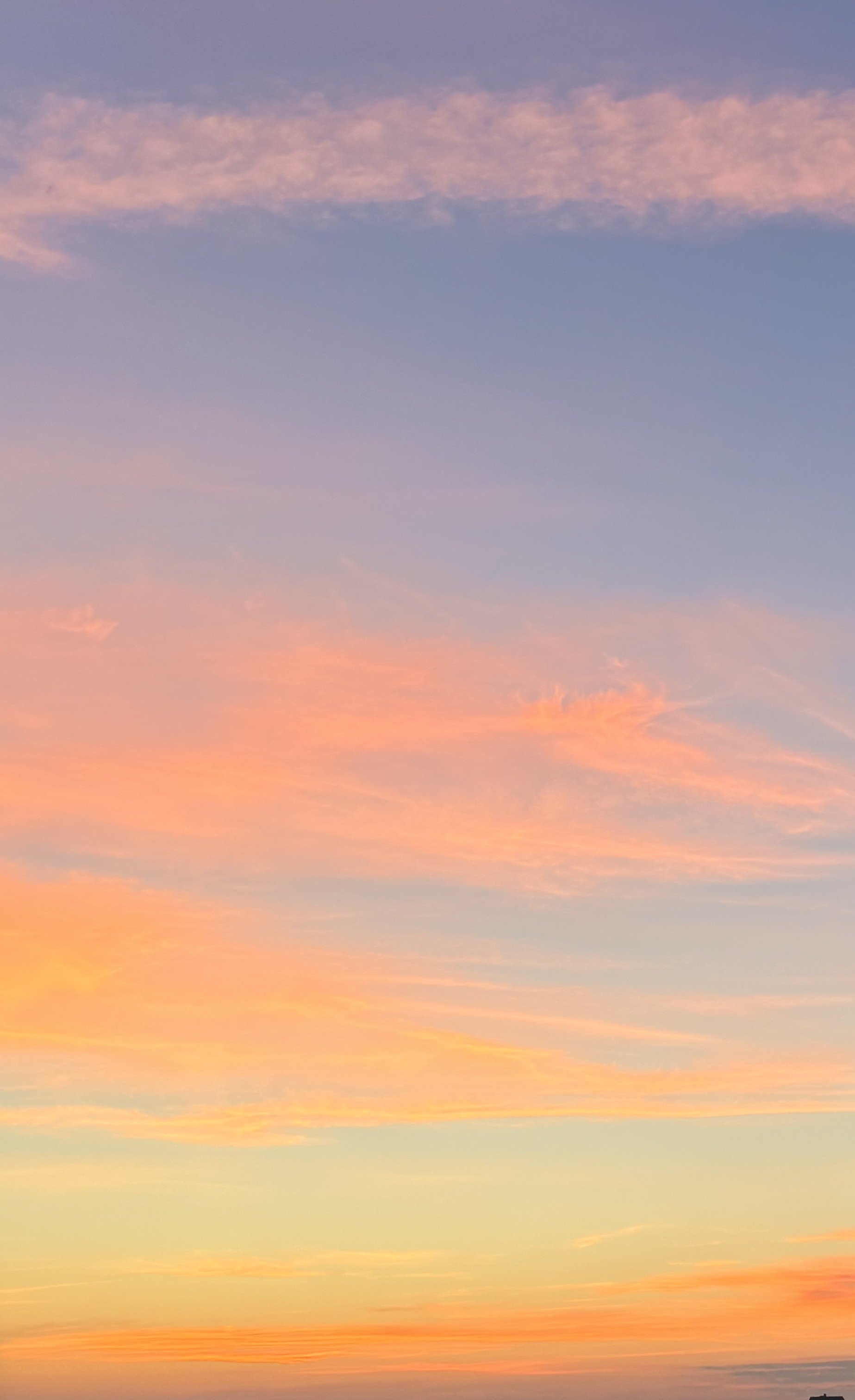 A colorful sunset sky with pink, purple, and orange clouds.