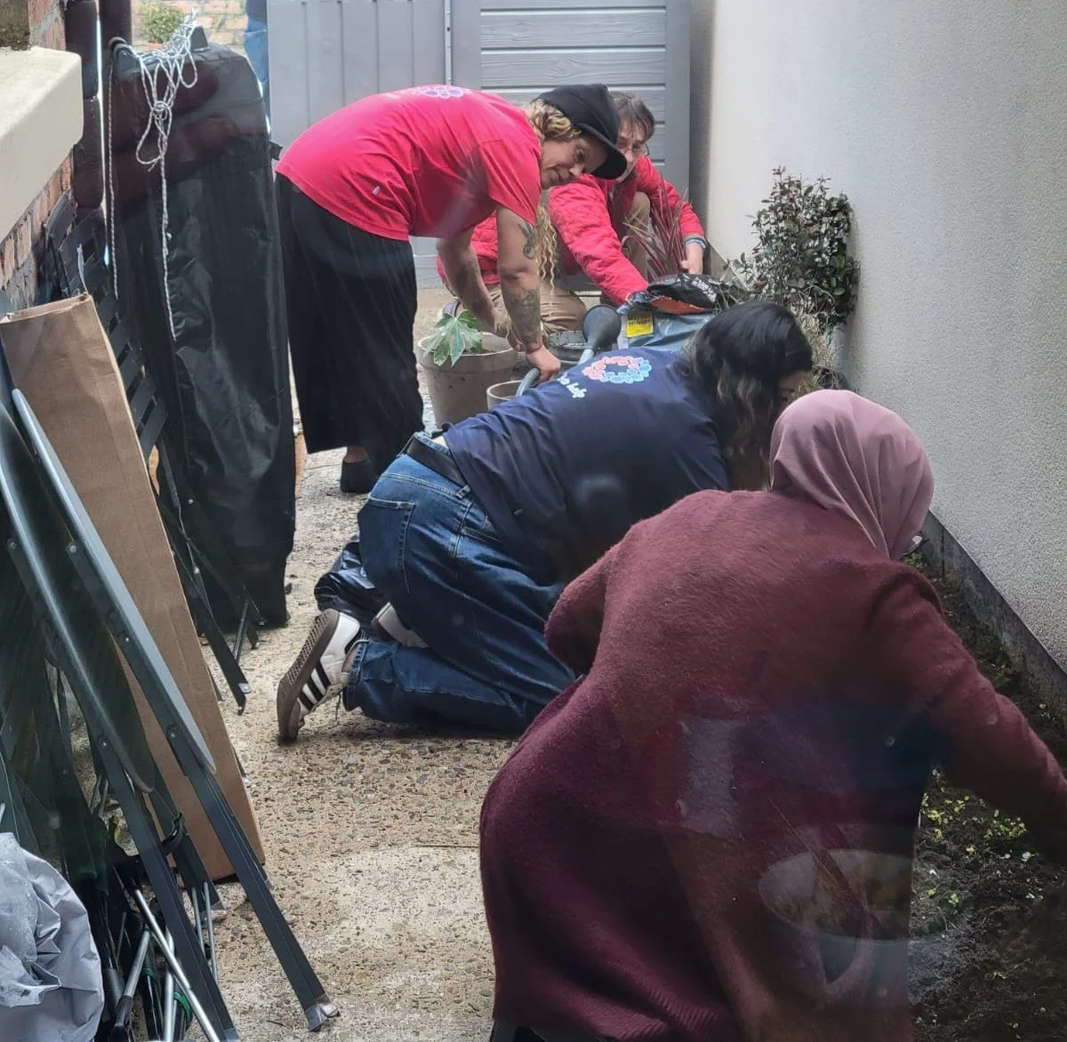 group of volunteers doing various gardening activities