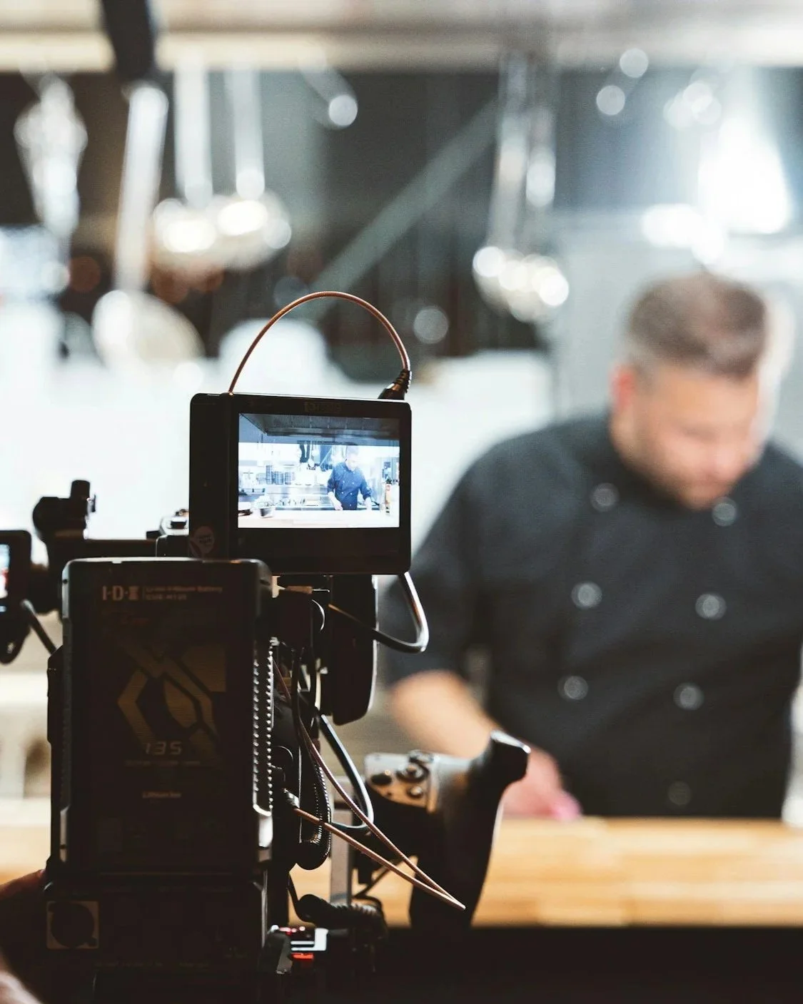 behind the scenes of a camera person filming