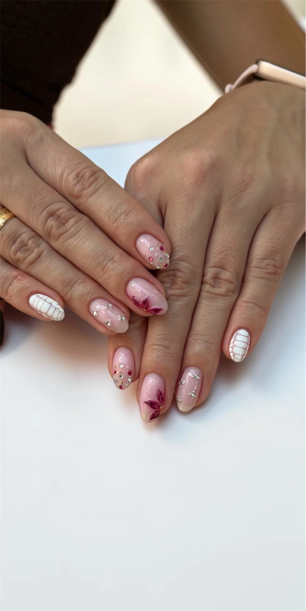 gel manicure with nail art pink french, flowers, stones and hand painting