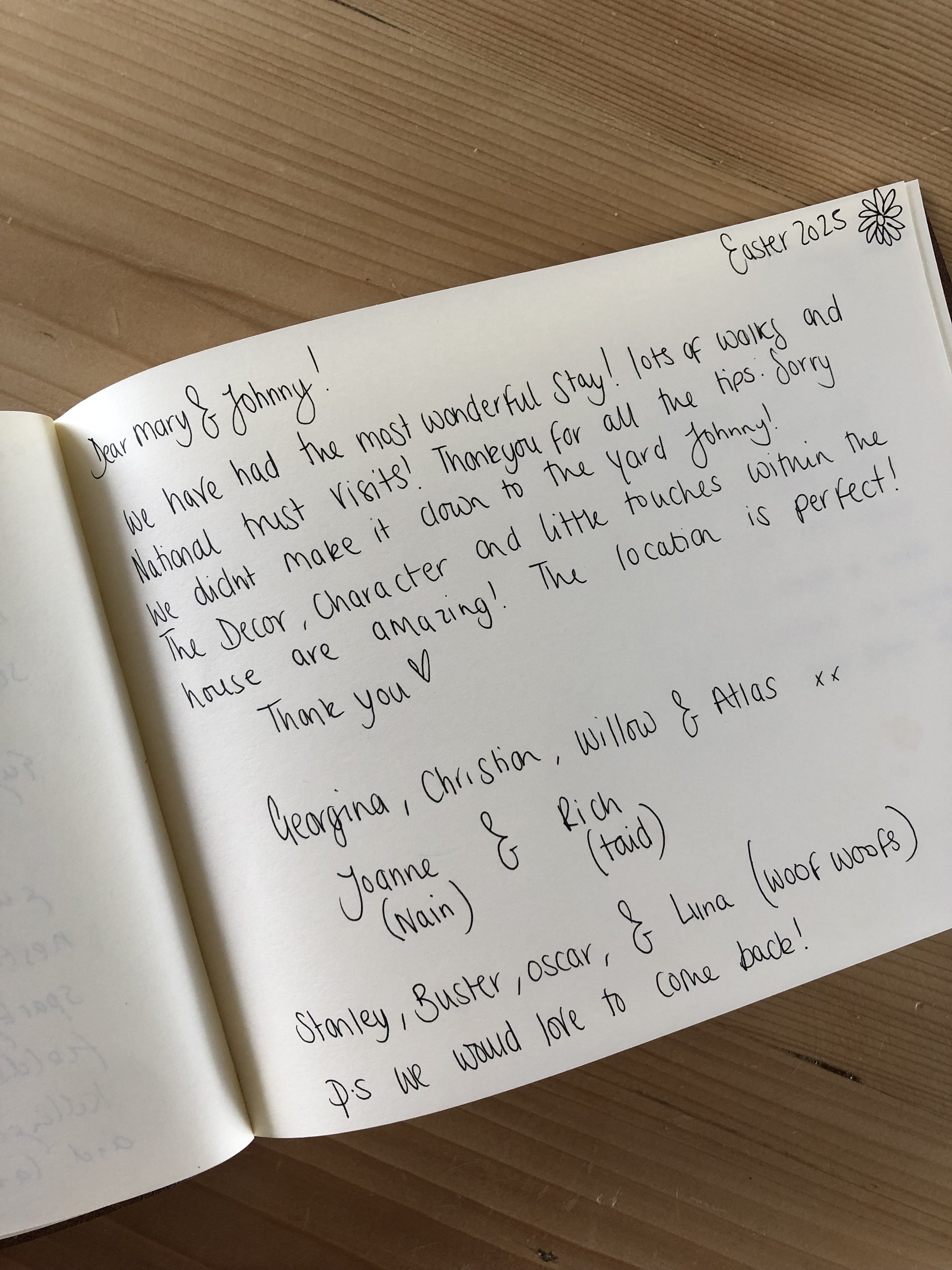 Handwritten thank you note in a guestbook, dated Easter 2023, with a floral doodle in the corner, expressing gratitude for a visit and mentioning family members.