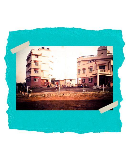 THE TWO JUBILEE HOME BUILDINGS WITH CHILDREN PLAYING BETWEEN THEM