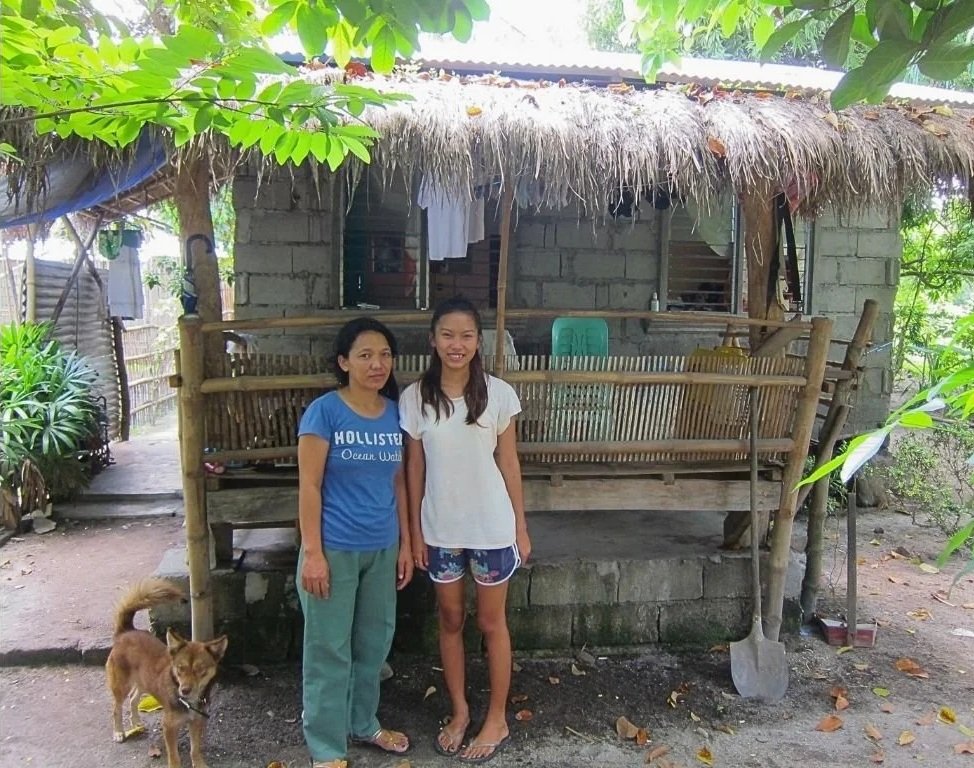 Filipino young person at risk of trafficking and exploitation standing outside their home