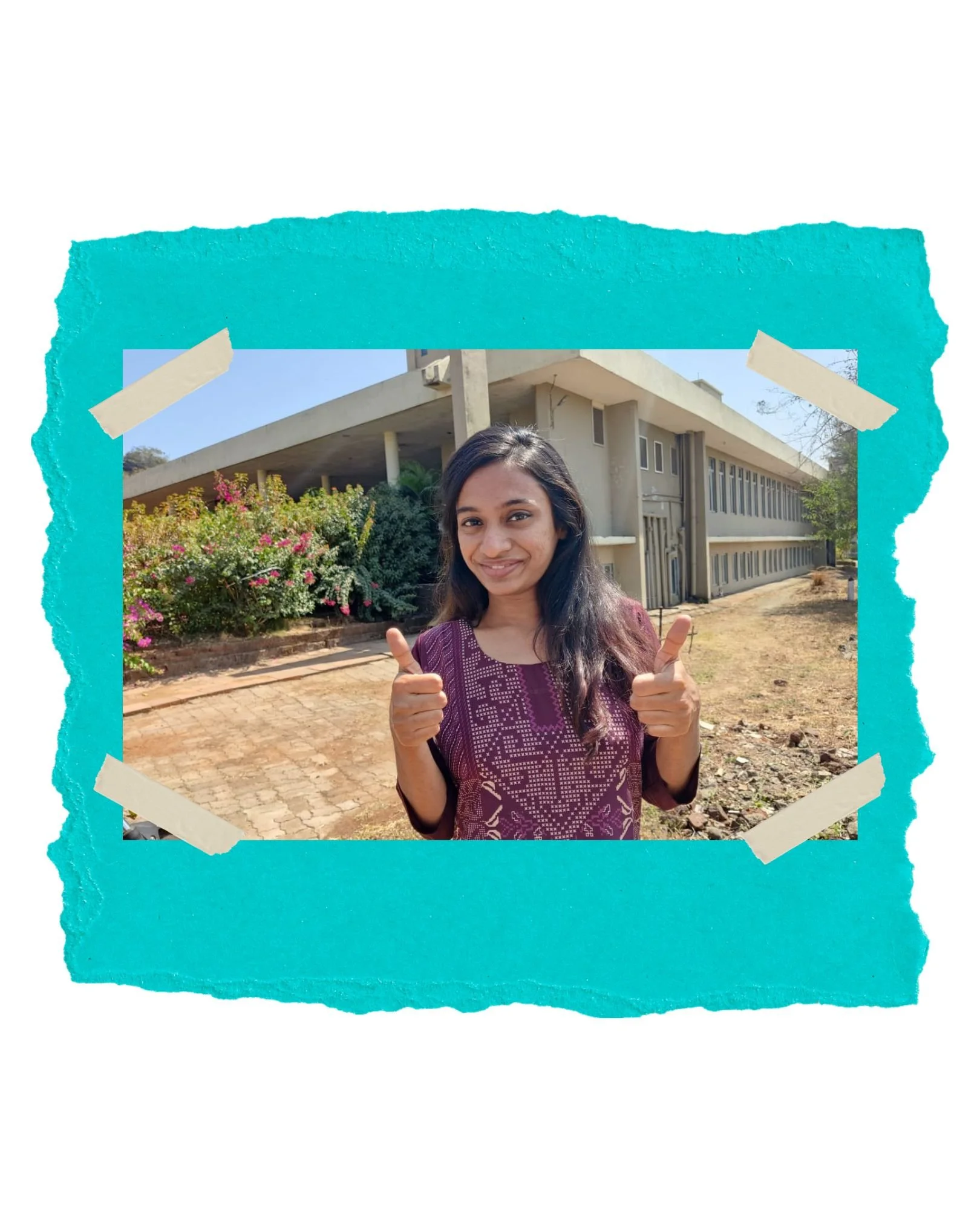 SHABANA OUTSIDE JUBILEE HOMES SHOWING TWO THUMBS UP IN CELEBRATION