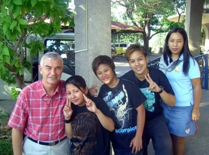 Fr Shay Cullen with scholarship students at Preda Foundation