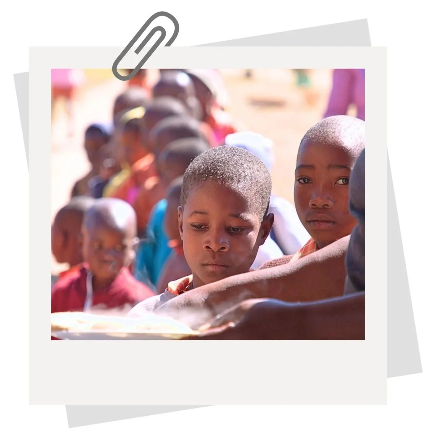 Children receiving food at Jessie's House day-care and infant school