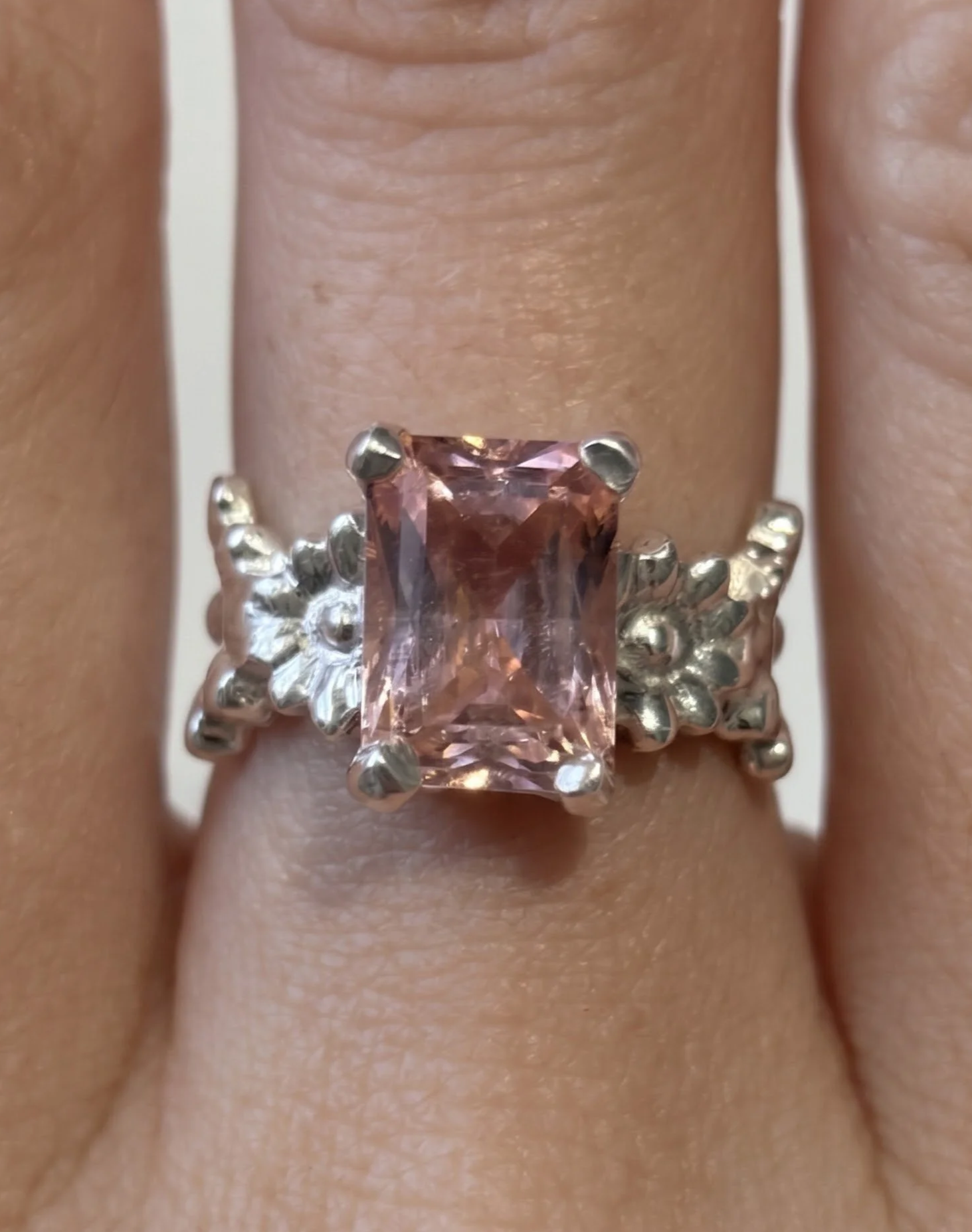 Silver ring with a pink gemstone made at a Culto Solar jewelry workshop