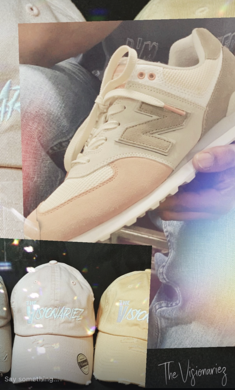 Close-up of a beige New Balance sneaker with cream and peach accents, held in a person's hand, with a background of denim jeans and other shoes and accessories.