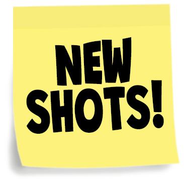 A yellow sticky note with bold black text that says 'NEW SHOTS!'
