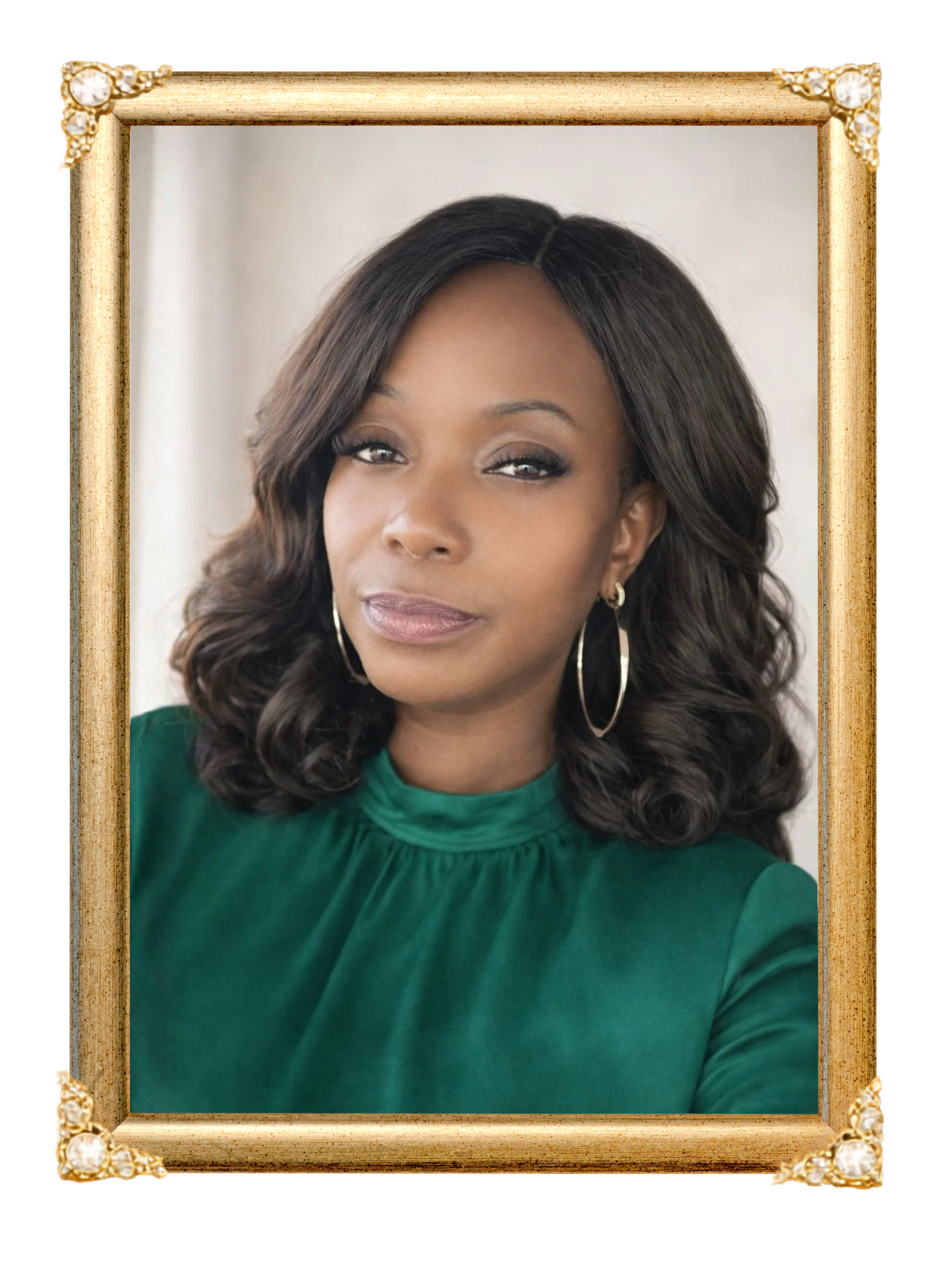 Portrait of a woman with dark, wavy hair wearing an emerald green blouse and gold hoop earrings.