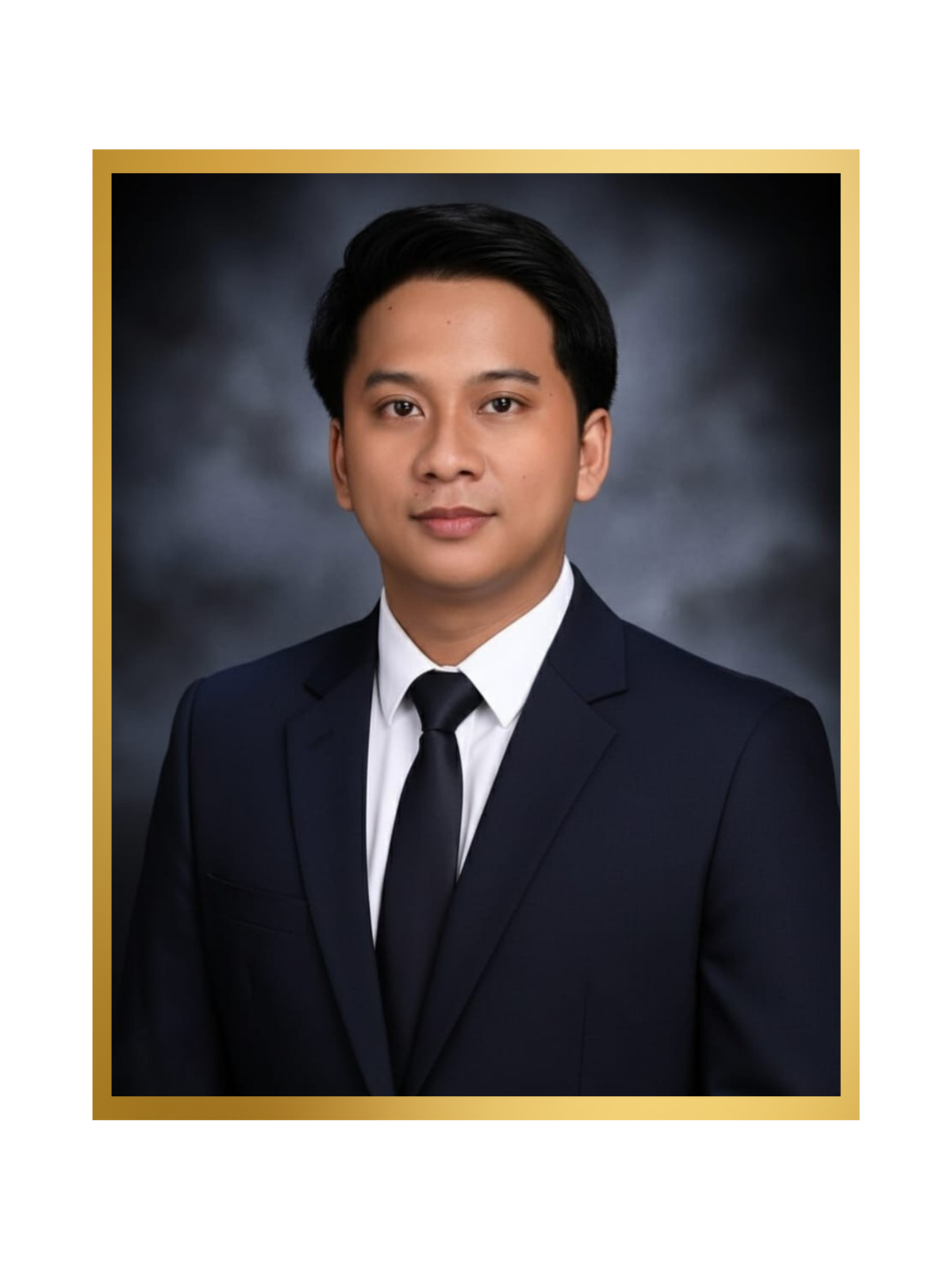 A young man in a formal suit and tie with a dark background and a gold border.