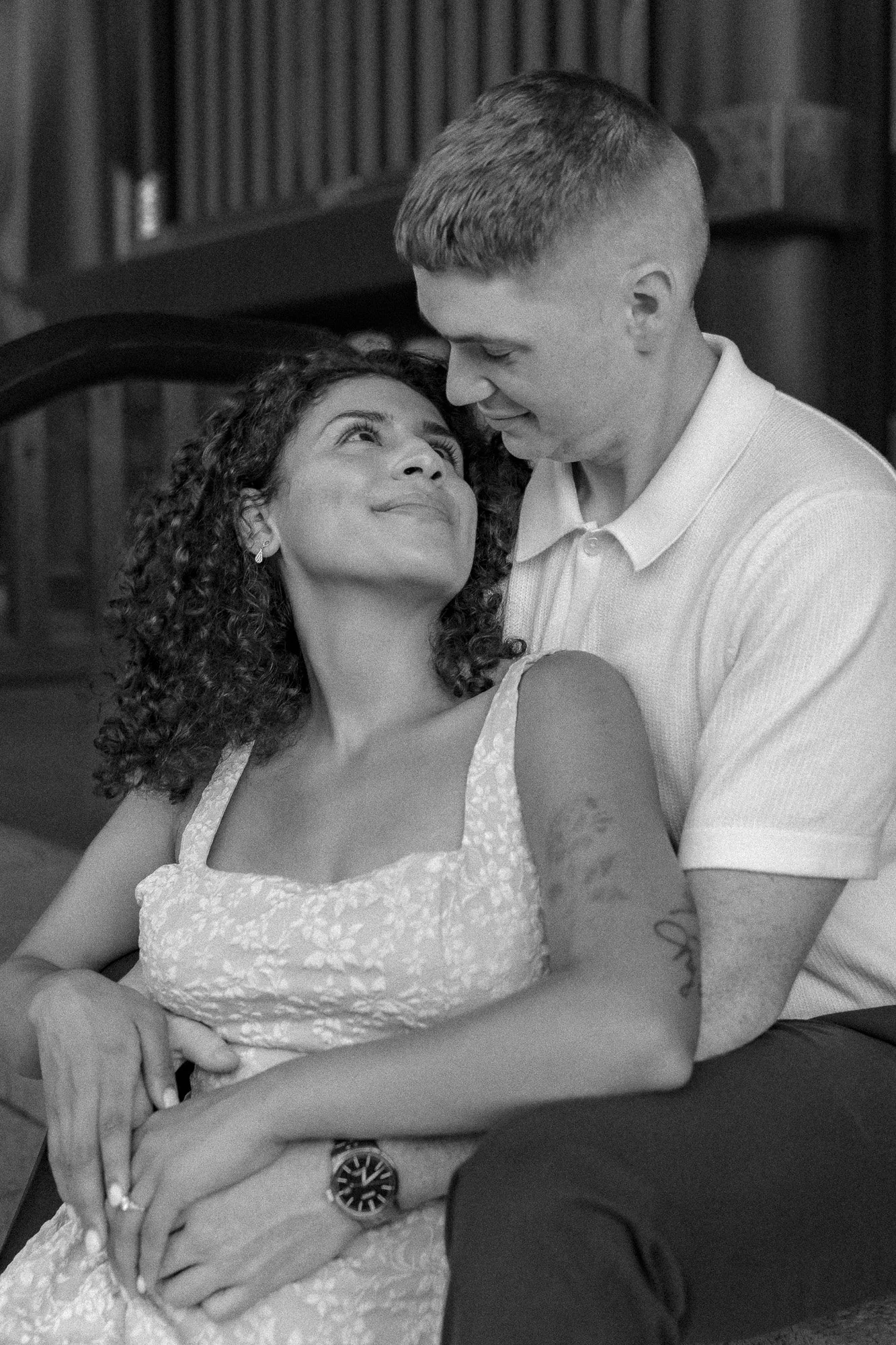 A couple sitting close together, gazing into each other's eyes, outside Japanese shrine, Asakusa