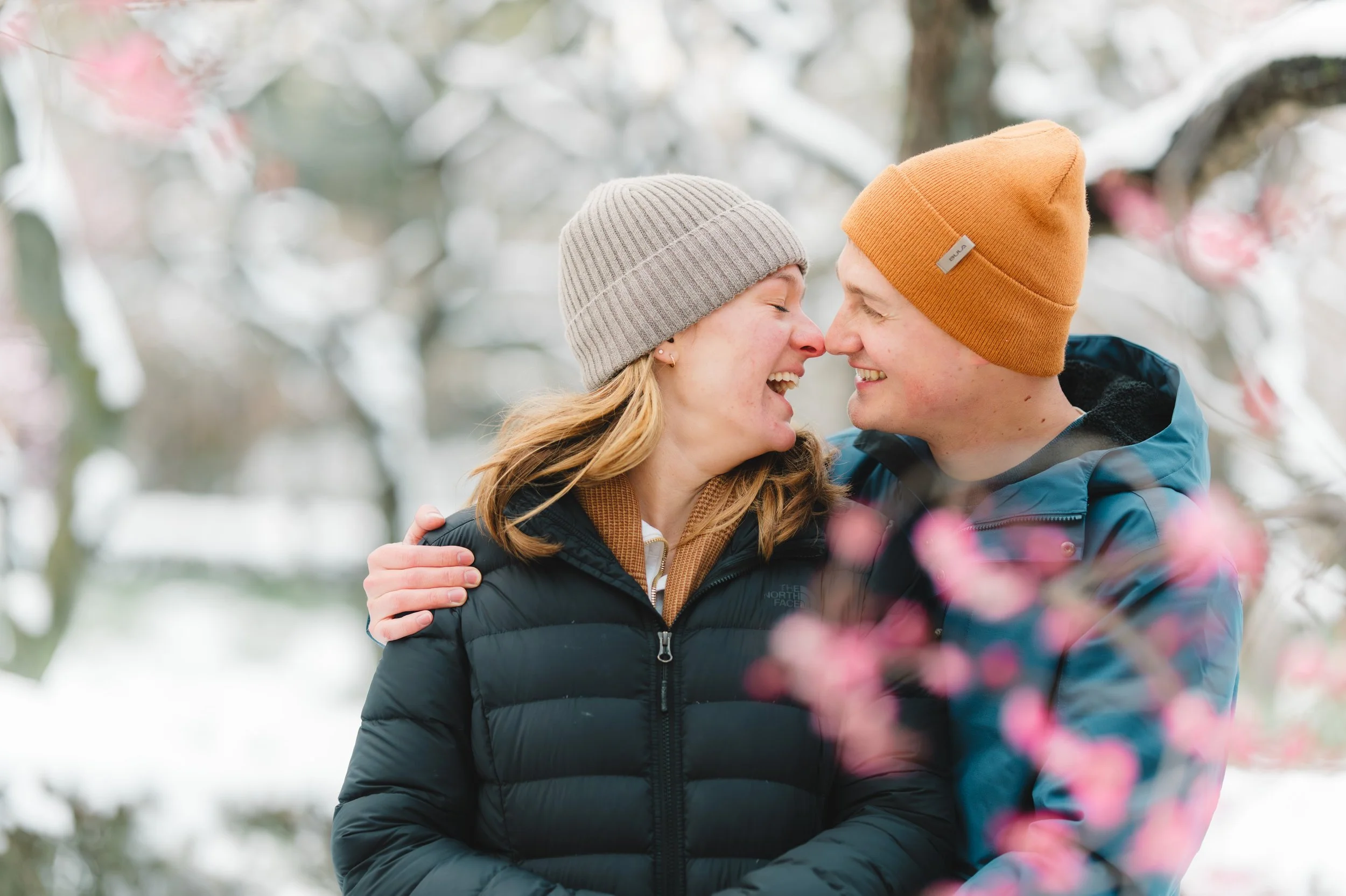 Emotional surprise proposal moment captured in Japan during cherry blossom