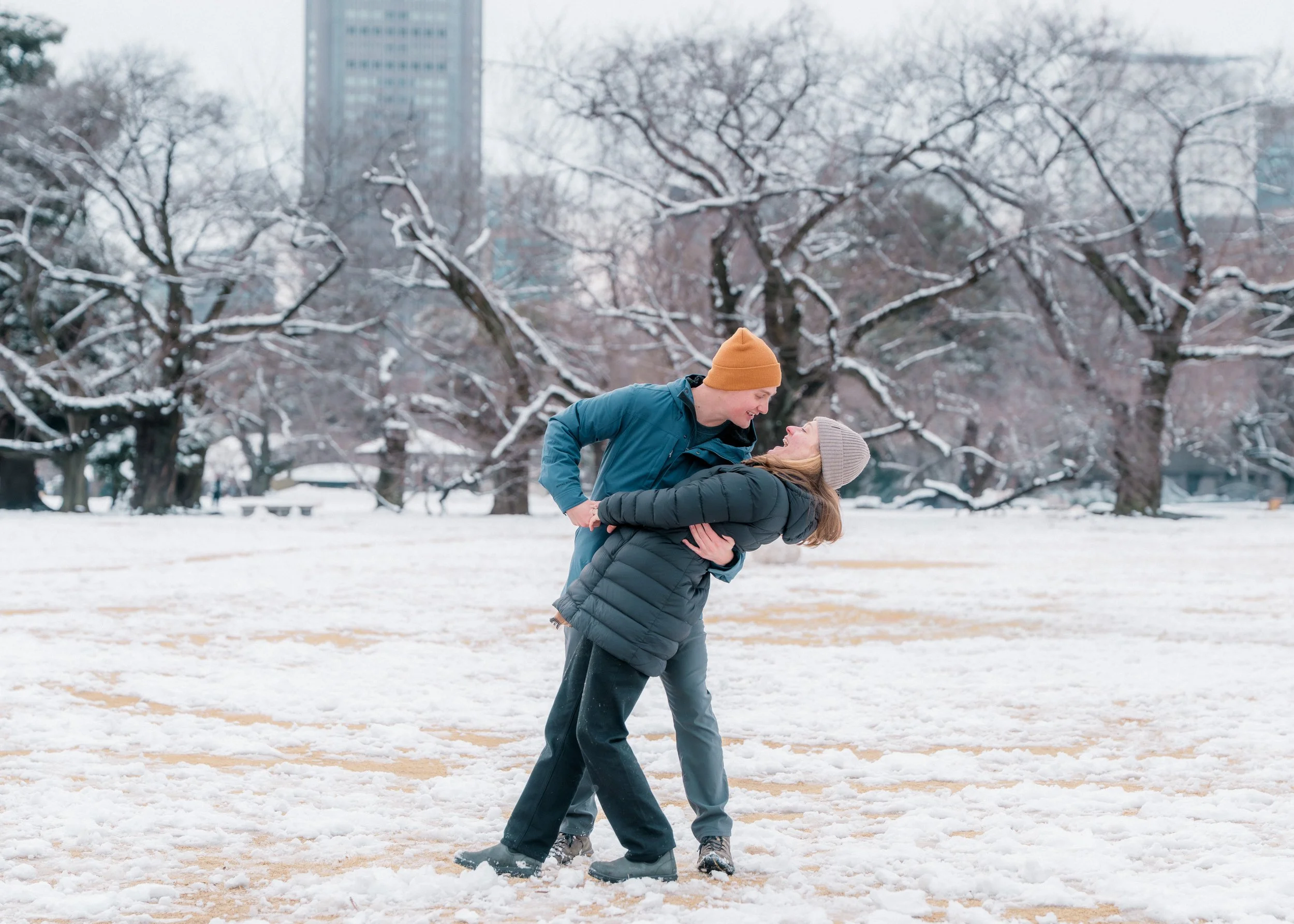 Couple celebrating proposal with beautiful Japan landscape