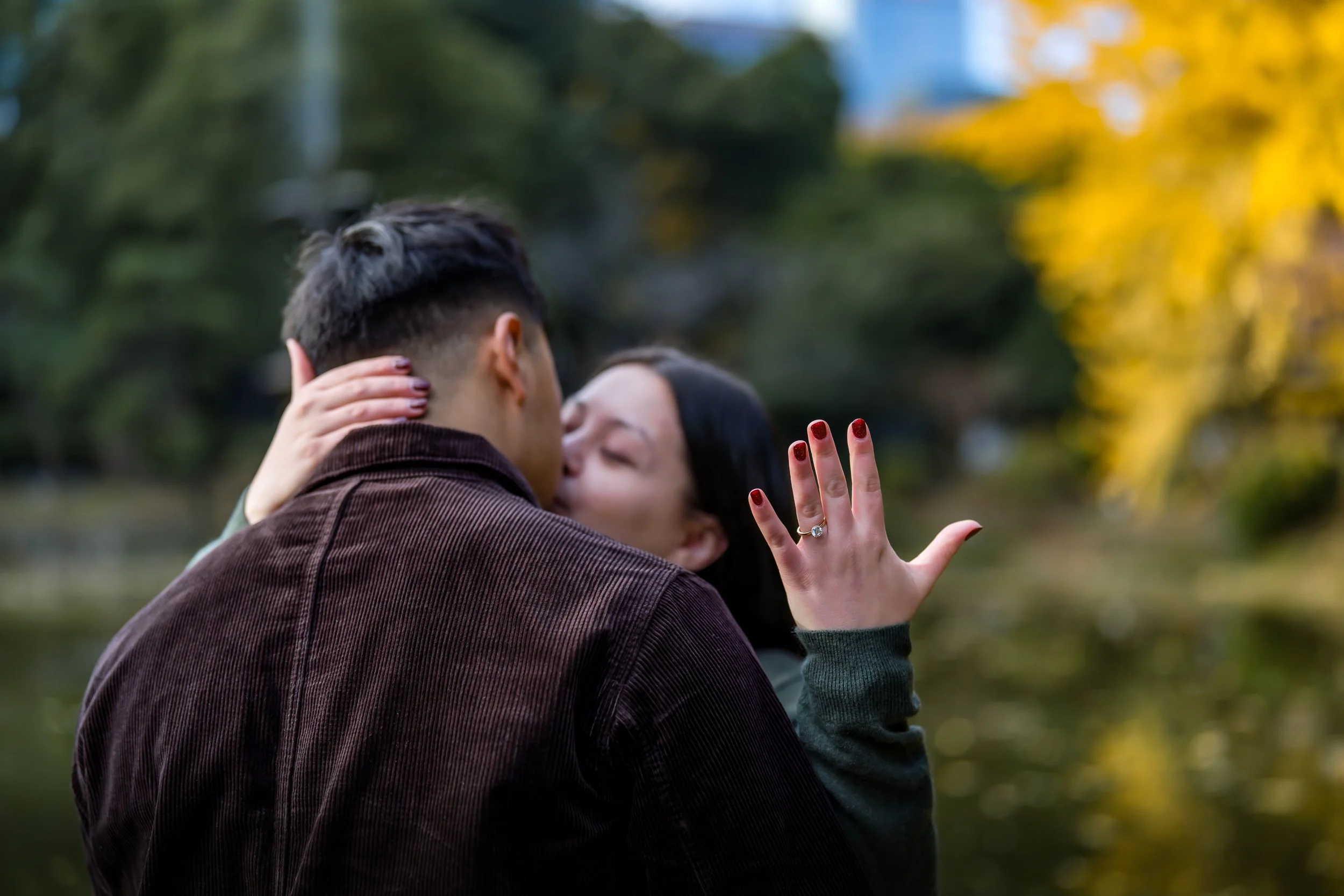 Proposal in Tokyo during autumn, showing off the ring