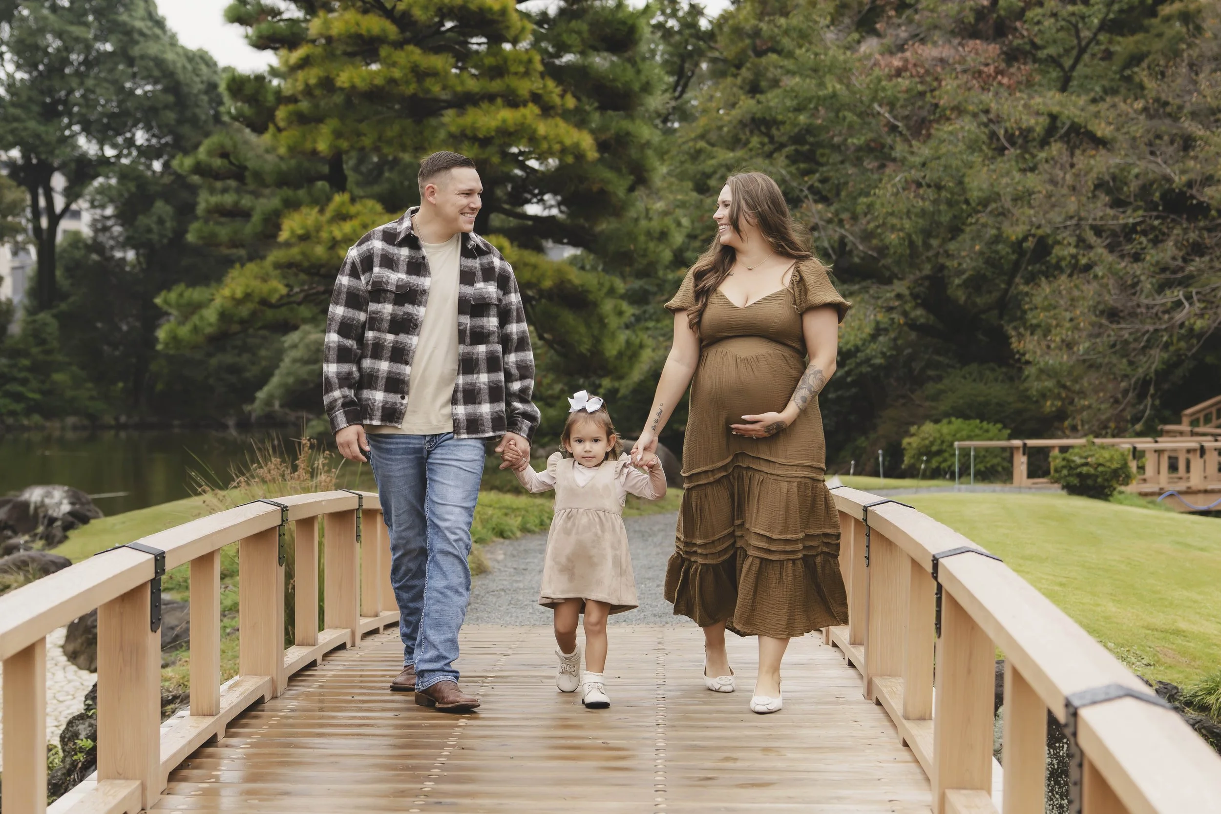 Family wearing coordinated autumn colours during a photoshoot in Japan