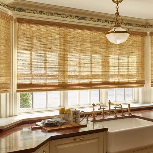 Kitchen with large window, bamboo blinds, and brass faucet over a white sink