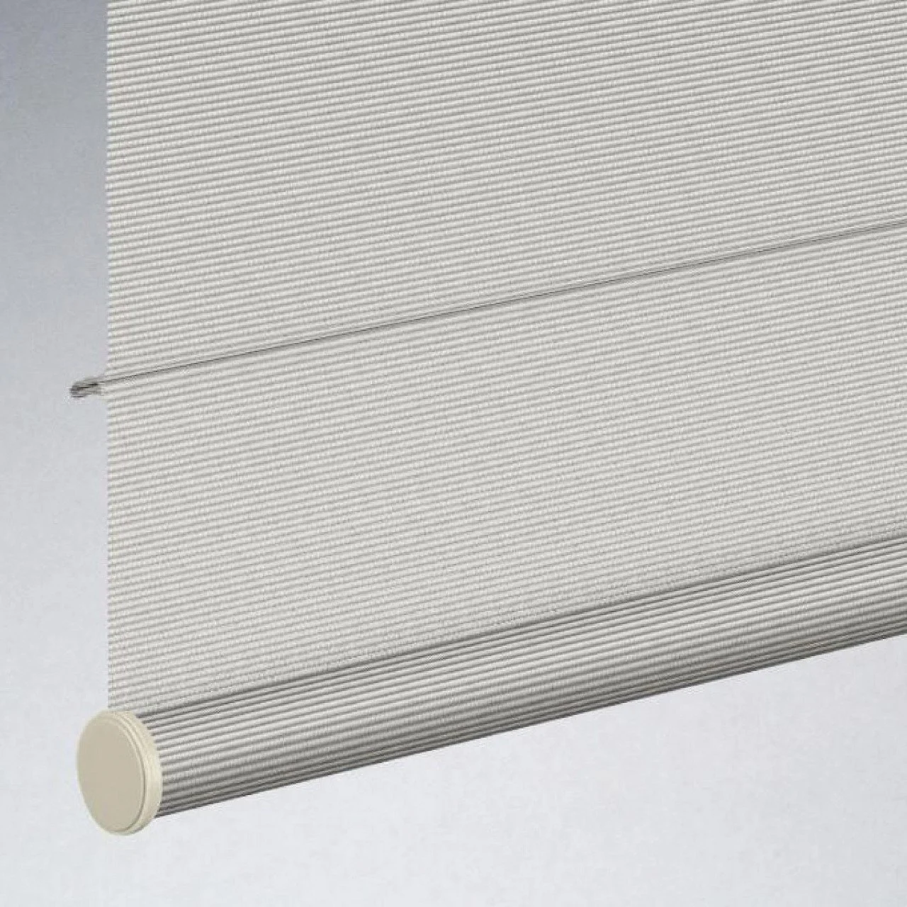 A white window blind with horizontal slats and a beige rolled-up bottom portion, mounted on the wall.